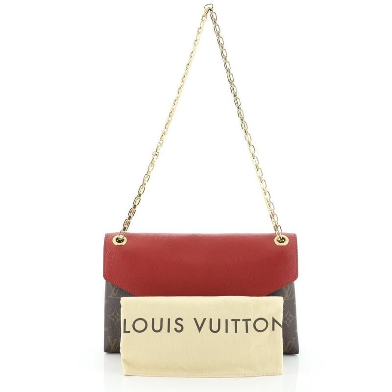This Louis Vuitton Pallas Chain Shoulder Bag Monogram Canvas and Calf Leather, crafted from brown monogram coated canvas and red calf leather, features dual chain link strap and gold-tone hardware. Its S-lock closure opens to a red microfiber