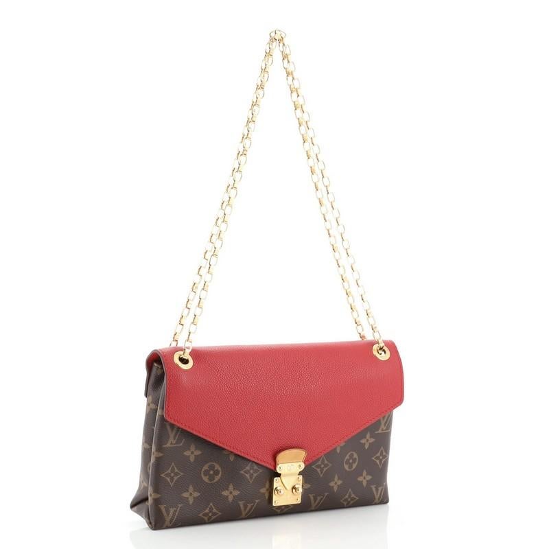 This Louis Vuitton Pallas Chain Shoulder Bag Monogram Canvas and Calf Leather, crafted from brown monogram printed canvas and red calfskin leather, features dual chain-link strap and gold-tone hardware. Its S-lock closure opens to a red microfiber