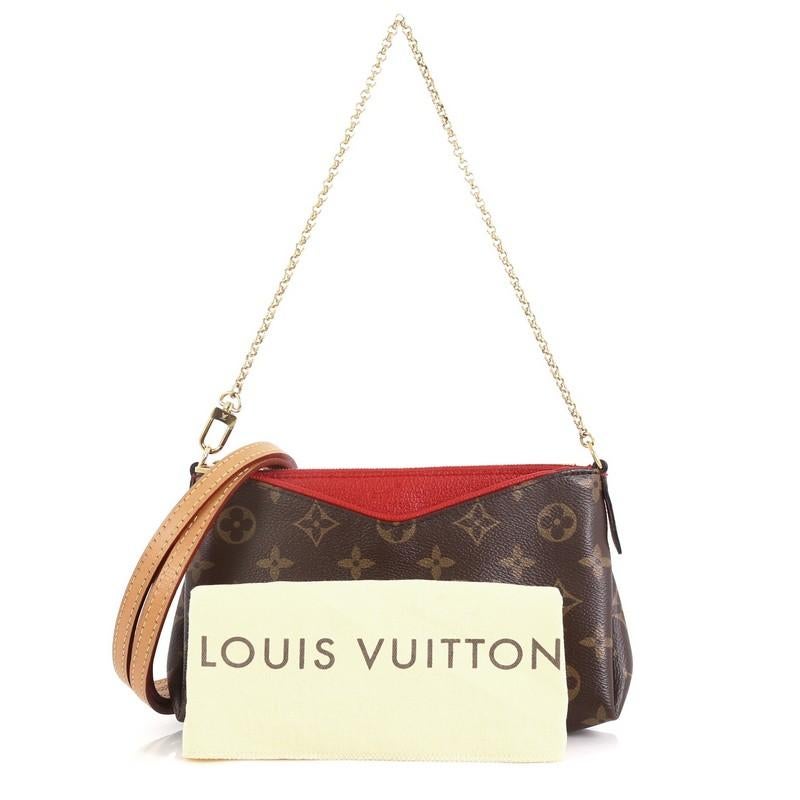 This Louis Vuitton Pallas Clutch Monogram Canvas, crafted from brown monogram coated canvas with a supple red calfskin leather trim, features a golden chain strap, leather cross-body leather strap, exterior front pocket and gold-tone hardware. Its