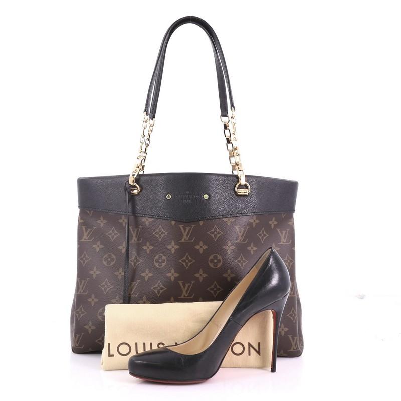 This Louis Vuitton Pallas Shopper Monogram Canvas and Calf Leather, crafted from brown monogram coated canvas with black calf leather, features chain-on-leather handles and gold-tone hardware. Its wide open top showcases a black microfiber interior