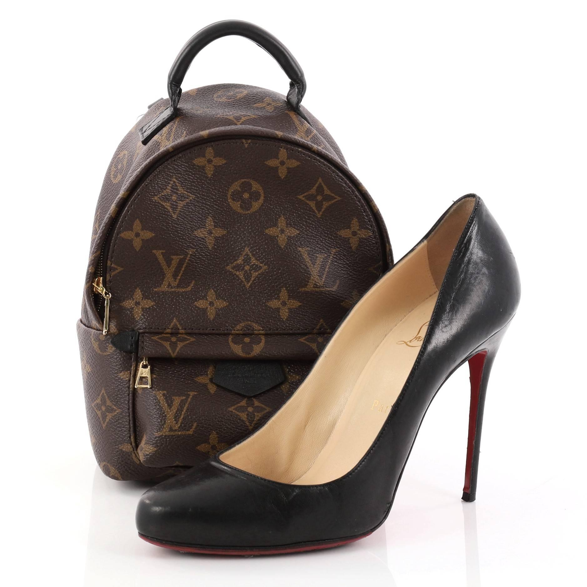 This authentic Louis Vuitton Palm Springs Backpack Monogram Canvas Mini is a stand-out piece made for care-free urban fashionistas. Crafted from brown monogram coated canvas, this chic functional backpack features padded leather top handle,