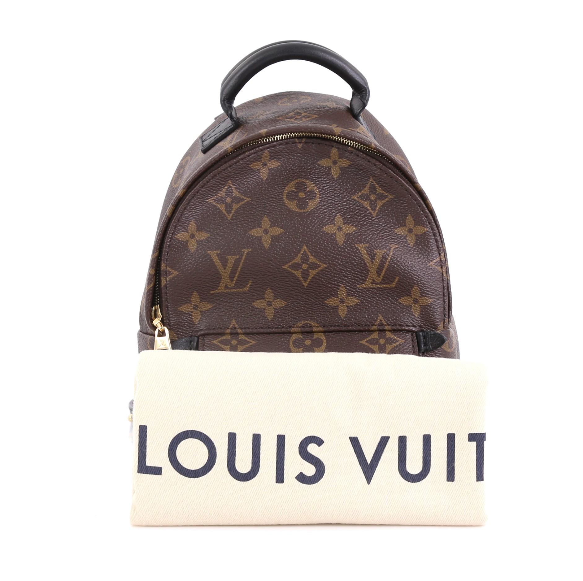 This Louis Vuitton Palm Springs Backpack Monogram Canvas Mini, crafted from brown monogram coated canvas, features a padded leather top handle, adjustable padded backpack shoulder straps, exterior front zip pocket, foam backing, and gold-tone