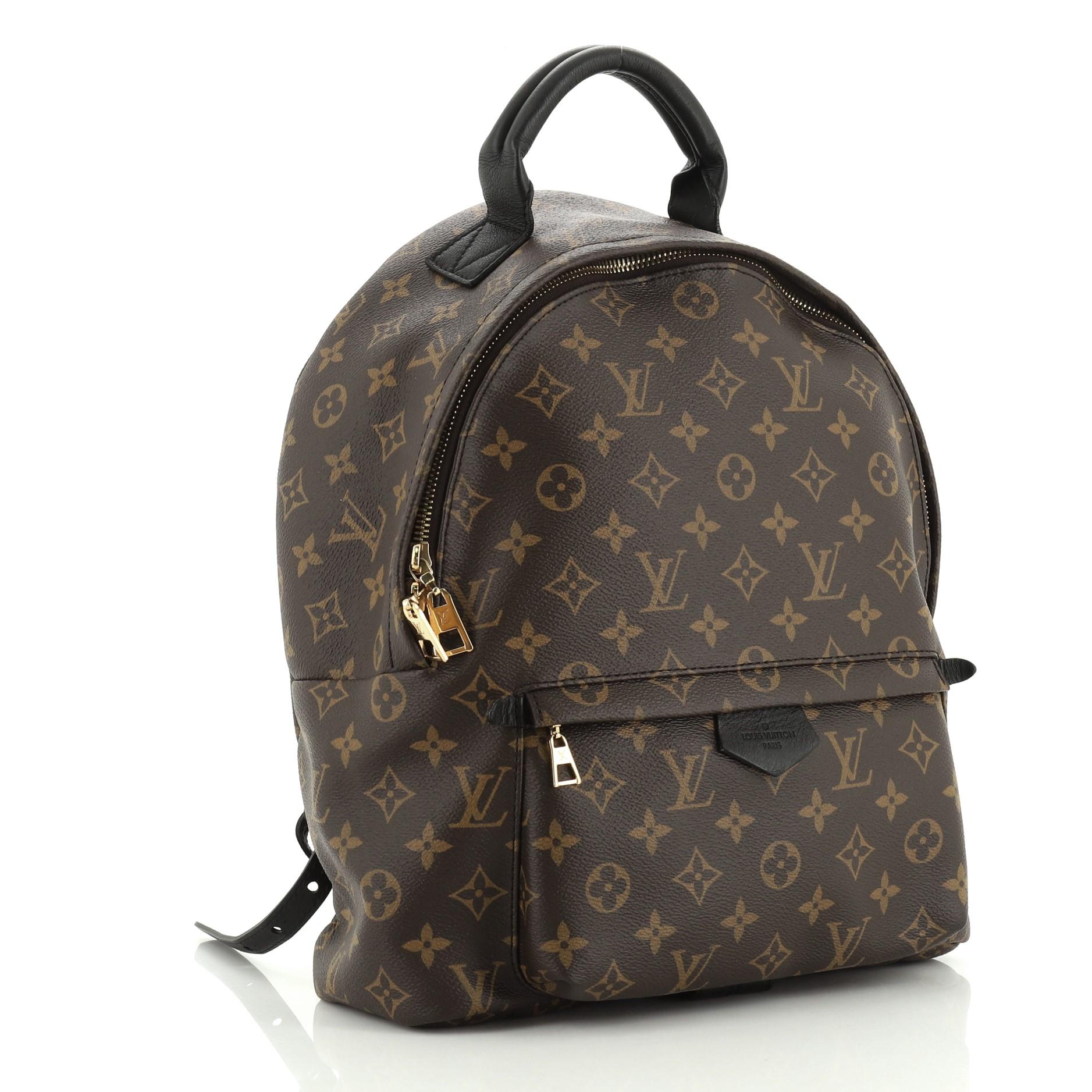 This Louis Vuitton Palm Springs Backpack Monogram Canvas MM, crafted from brown monogram coated canvas, features adjustable shoulder straps, exterior front zip pocket, and gold-tone hardware. Its two-way zip closure opens to a black nylon and fabric
