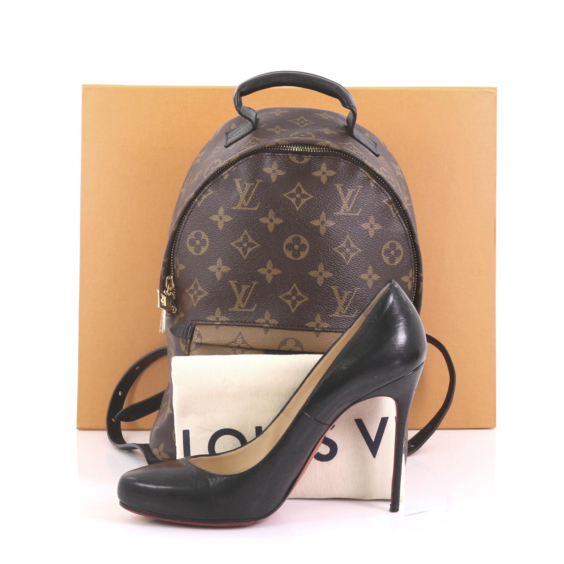 This Louis Vuitton Palm Springs Backpack Reverse Monogram Canvas PM, crafted from brown reverse monogram coated canvas, features padded leather top handle, adjustable shoulder straps, exterior front zip pocket, foam backing, and gold-tone hardware.