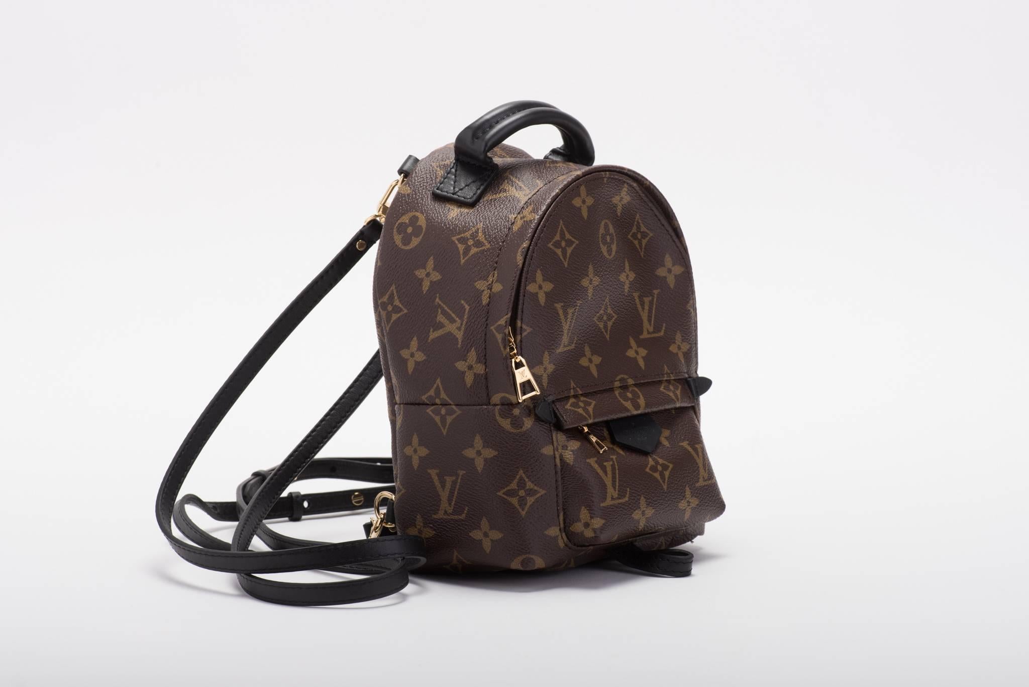 Louis Vuitton SOLD OUT mini monogram backpack. 
Nicolas Ghesquière new take on a very classic staple of the Vuitton collection. 
The mini monogram canvas sports a multi-positional strap for cross-body wear. 
Brand new in box with booklet, dust cover