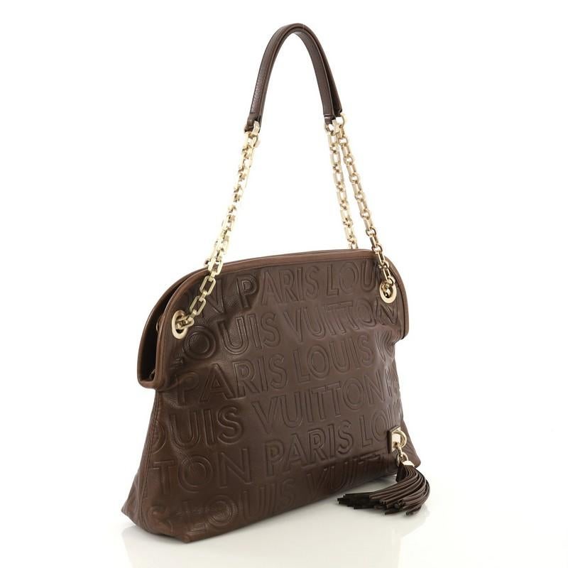 This Louis Vuitton Paris Souple Wish Bag Leather, crafted from brown leather, features leather handles with chain links, embossed Louis Vuitton logo throughout, leather tassel, and gold-tone hardware. Its zip closure opens to a brown microfiber
