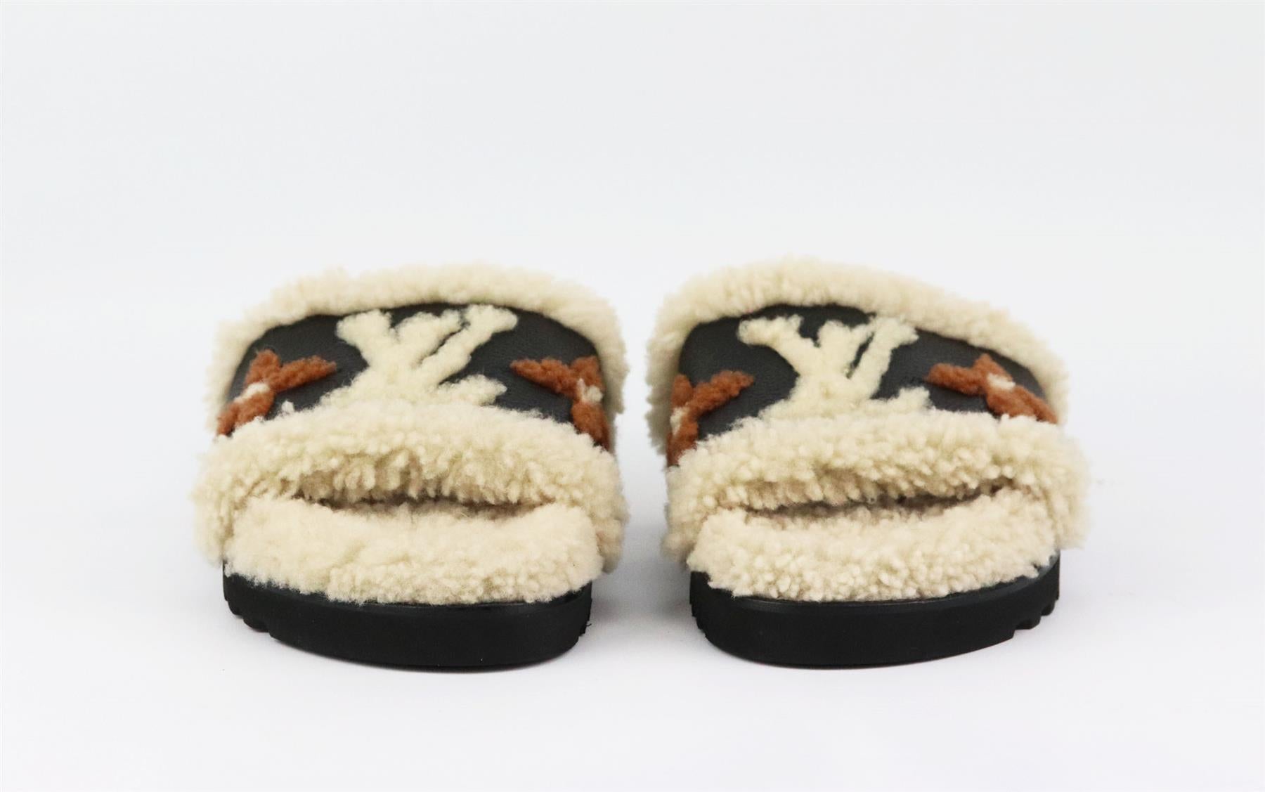 These 'Paseo' slides by Louis Vuitton are made in Italy from plush shearling, they have cushioned heels and wide leather straps detailed with the house's instantly recognizable 'LV' motif in shearling. Sole measures approximately 50 mm/ 2 inches.