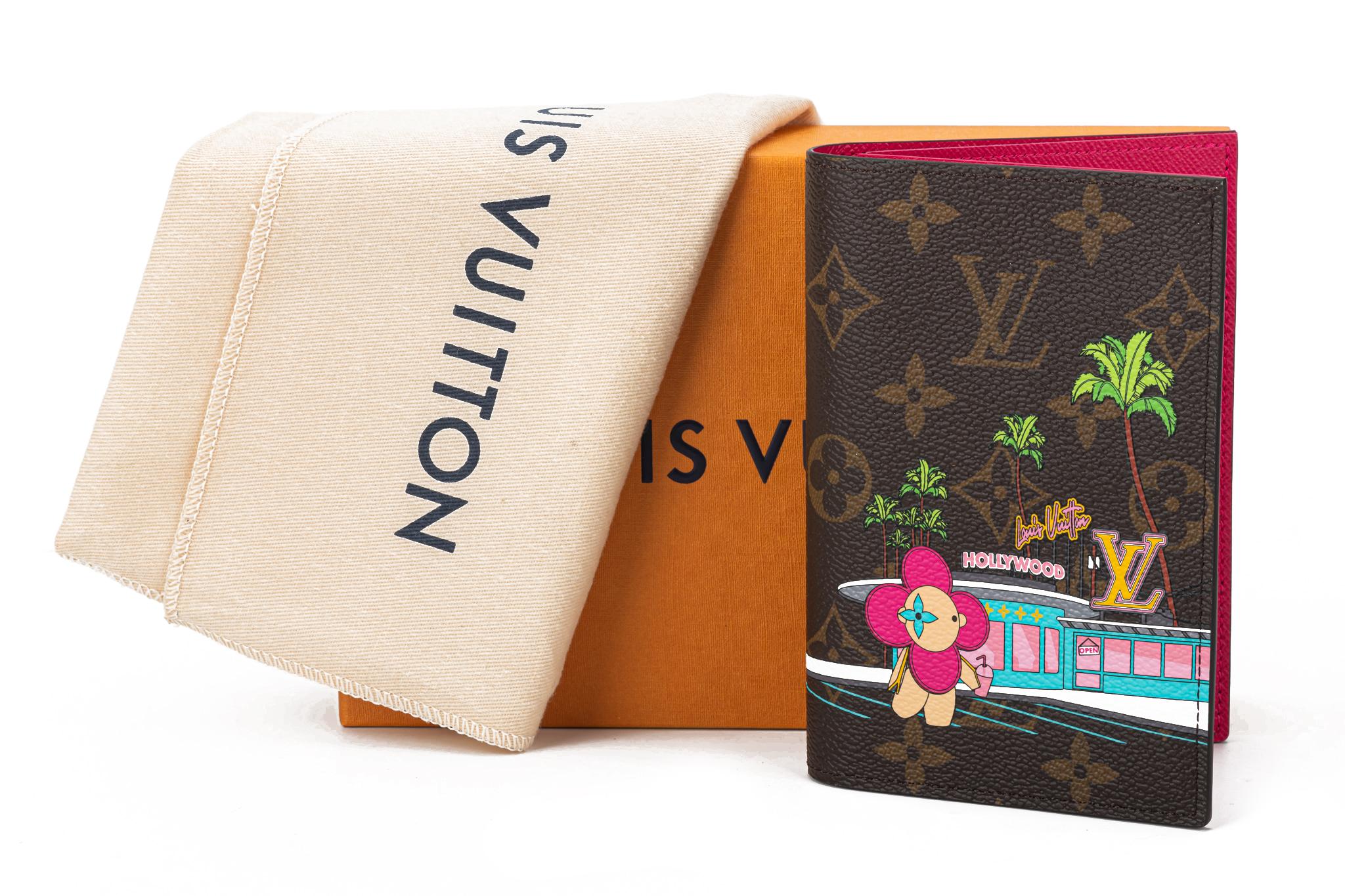 Louis Vuitton Passport Cover Hollywood XMAS Christmas 2021 Vivienne Monogram. The Passport Cover is made from Monogram canvas with a limited edition print of Vivienne, the Louis Vuitton mascot, on Hollywood Drive. The item is in excellent condition.