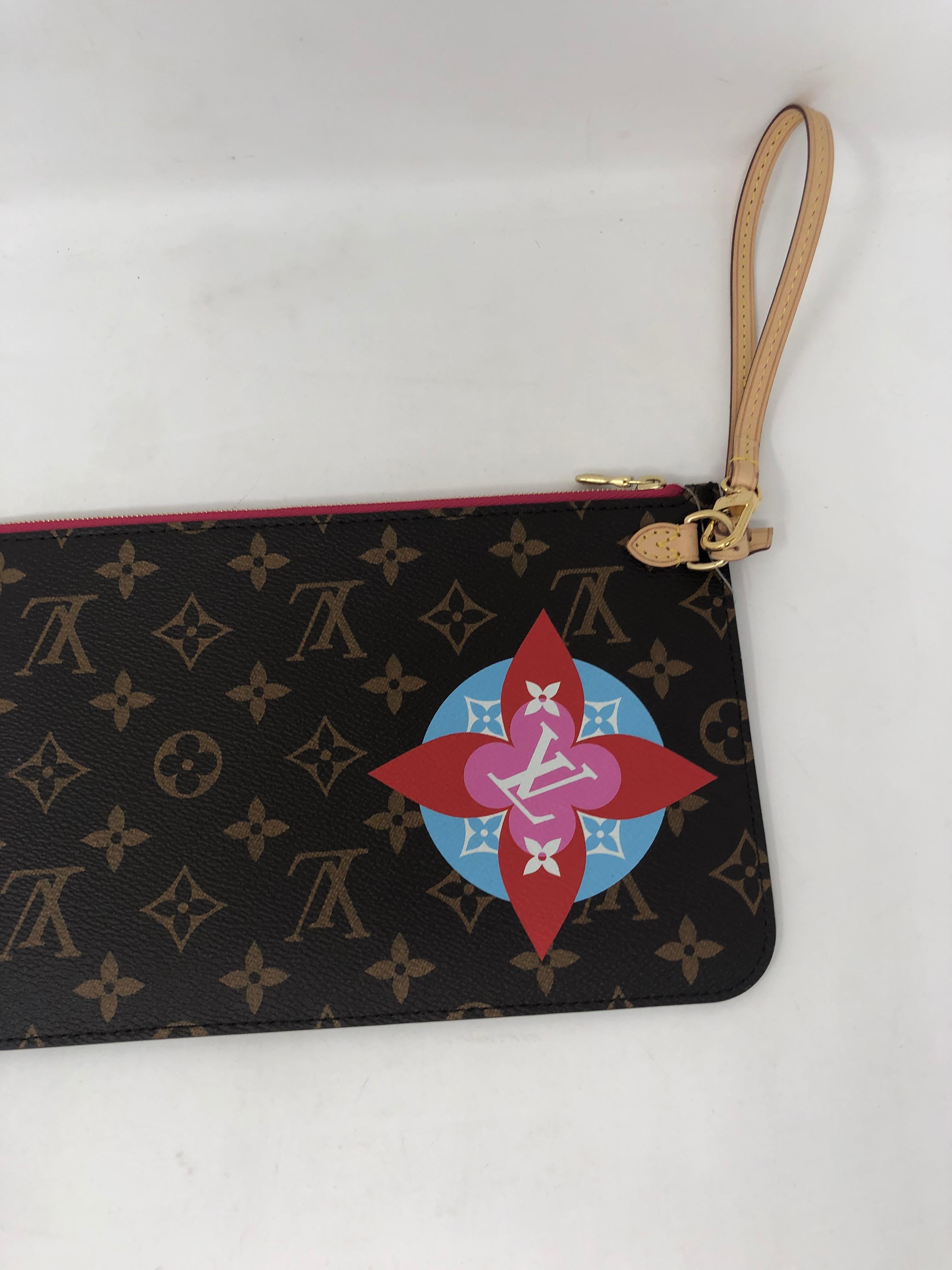 Louis Vuitton Pochette Patches Collection. Limited LV wristlet from Neverfull. Brand new condition. Never worn. Guaranteed authentic. 