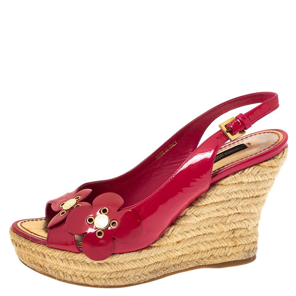 Louis Vuitton made these sandals to crown your feet with beauty. They are constructed with patent leather and held by slingbacks. Floral details on the uppers and espadrille wedge heels make the pair ready to be worn and flaunted.

