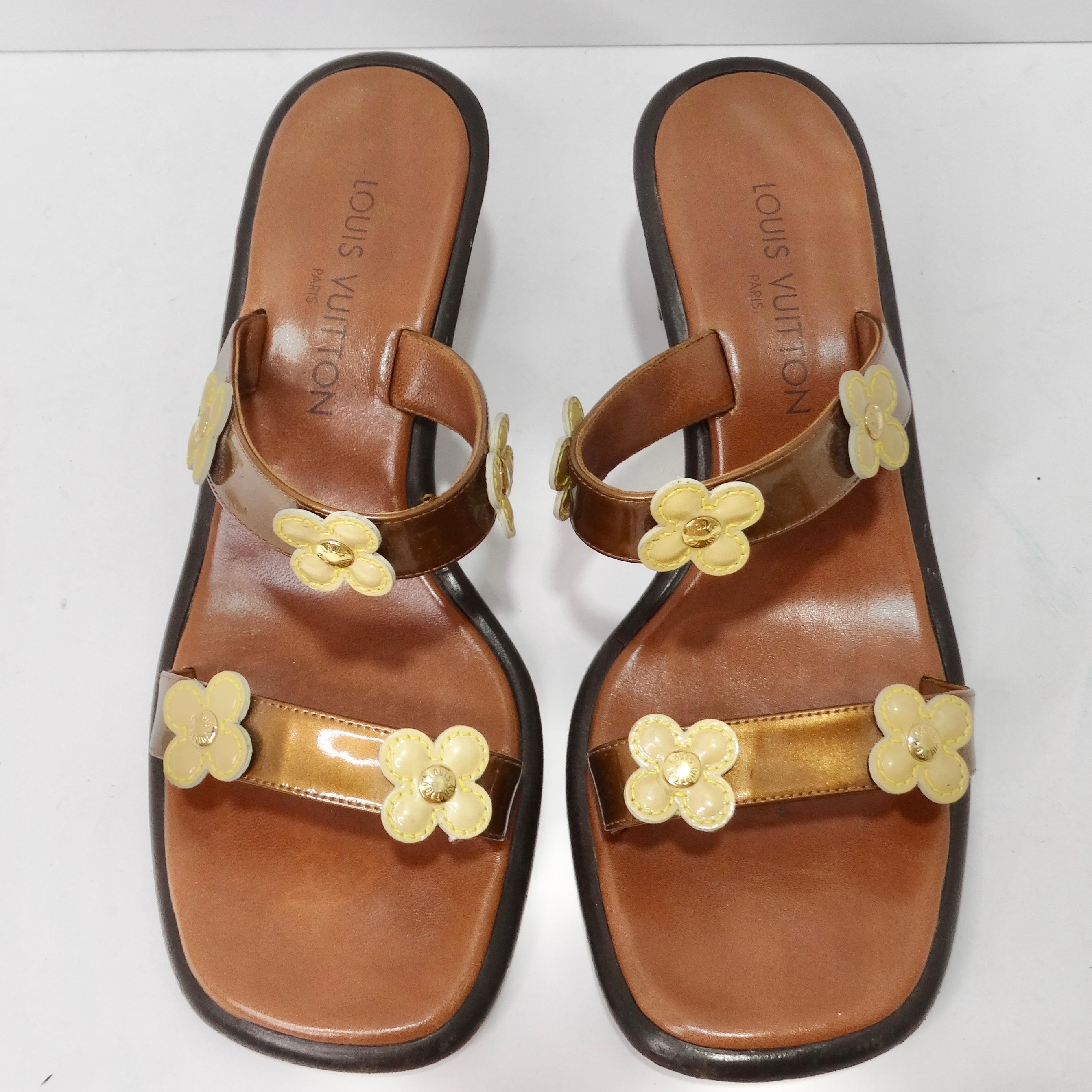 Step into the world of high fashion with these Louis Vuitton Patent Leather Flower Heels. These luxurious brown slip-on sandals redefine elegance and style, combining exceptional craftsmanship with playful design. With two brown patent leather
