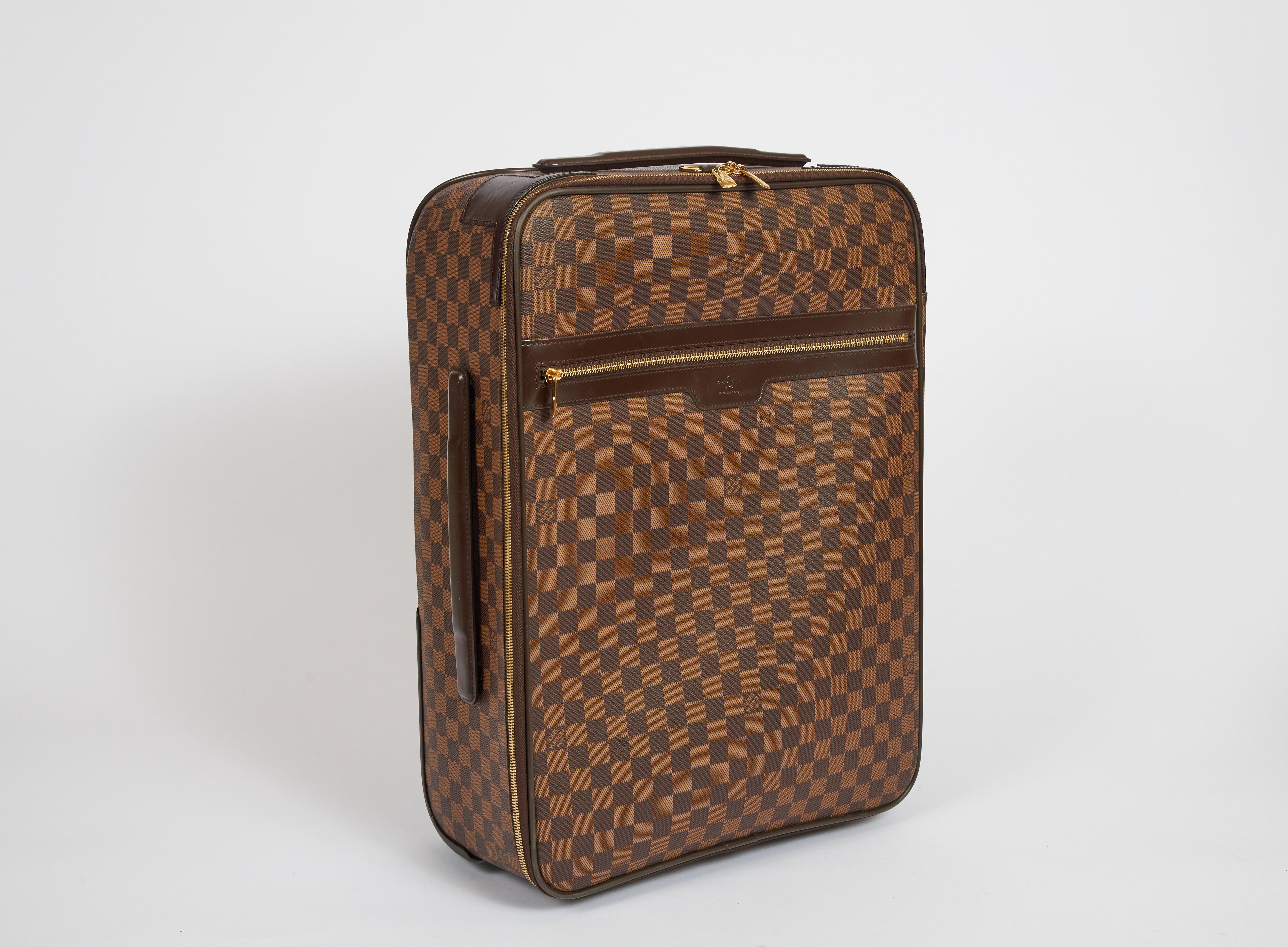 Vuitton Damier Pegase 55 Carry On Suitcase. Condition is Pre-owned. Please refer to photos for minor scratches. Plastic is still on interior zipper pulls. Item has been used a few times. Comes with original vuitton dust cover. Free us continental