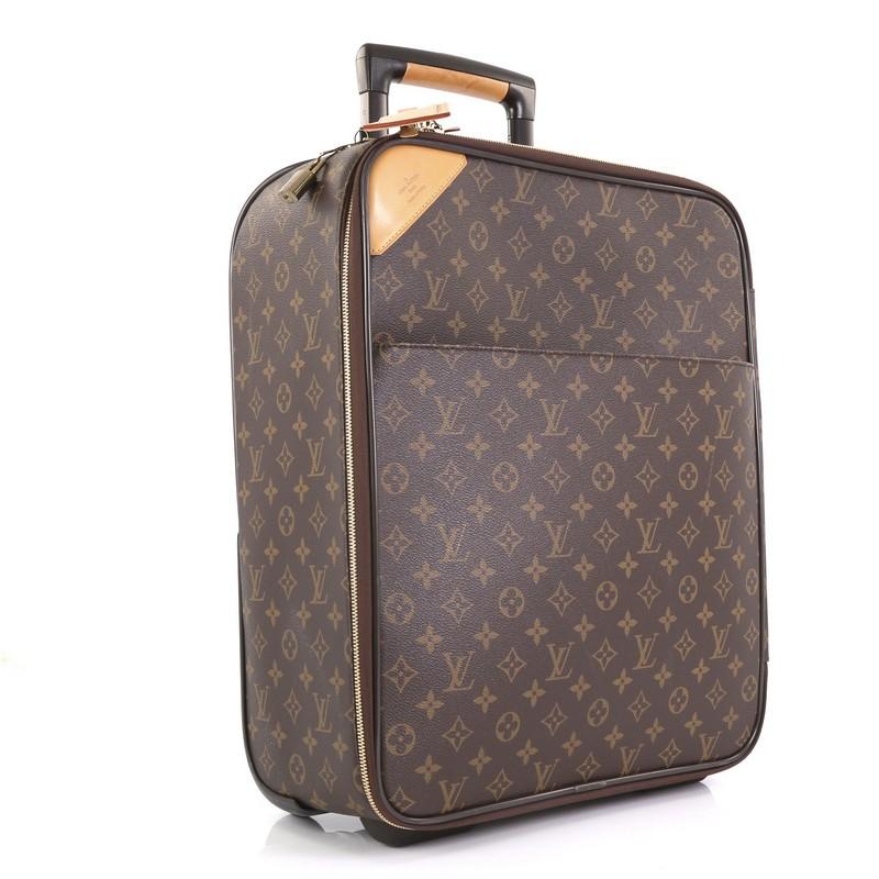 This Louis Vuitton Pegase Luggage Monogram Canvas 45, crafted from brown monogram coated canvas, features a retractable handle with lock button and rolling system, cowhide leather trim and gold-tone hardware. Its all-around zip closure opens to a