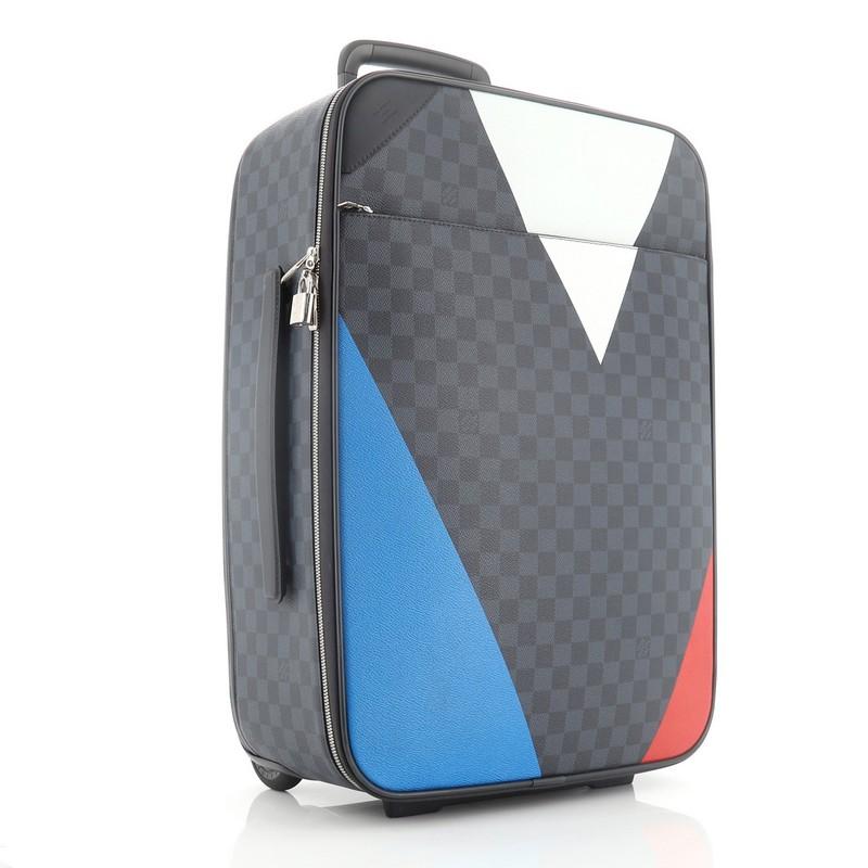This Louis Vuitton Pegase Luggage Regatta Damier Cobalt 55, crafted from damier cobalt coated canvas, features a retractable handle with lock button and rolling system, modern interpretation of the historical V Gaston logo, and silver-tone hardware.