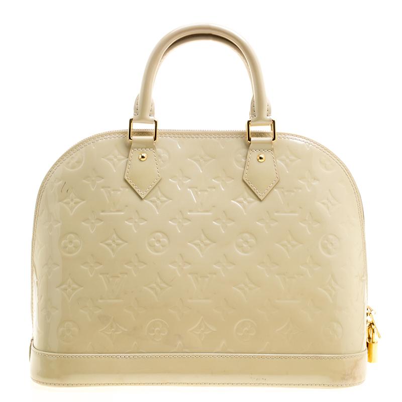A classic from the house of Louis Vuitton, the shape of the Alma stands out. Louis Vuitton Alma was named after the Alma Bridge that connects Paris's fashionable neighborhood. The bag is made from the signature Monogram Vernis that was introduced in