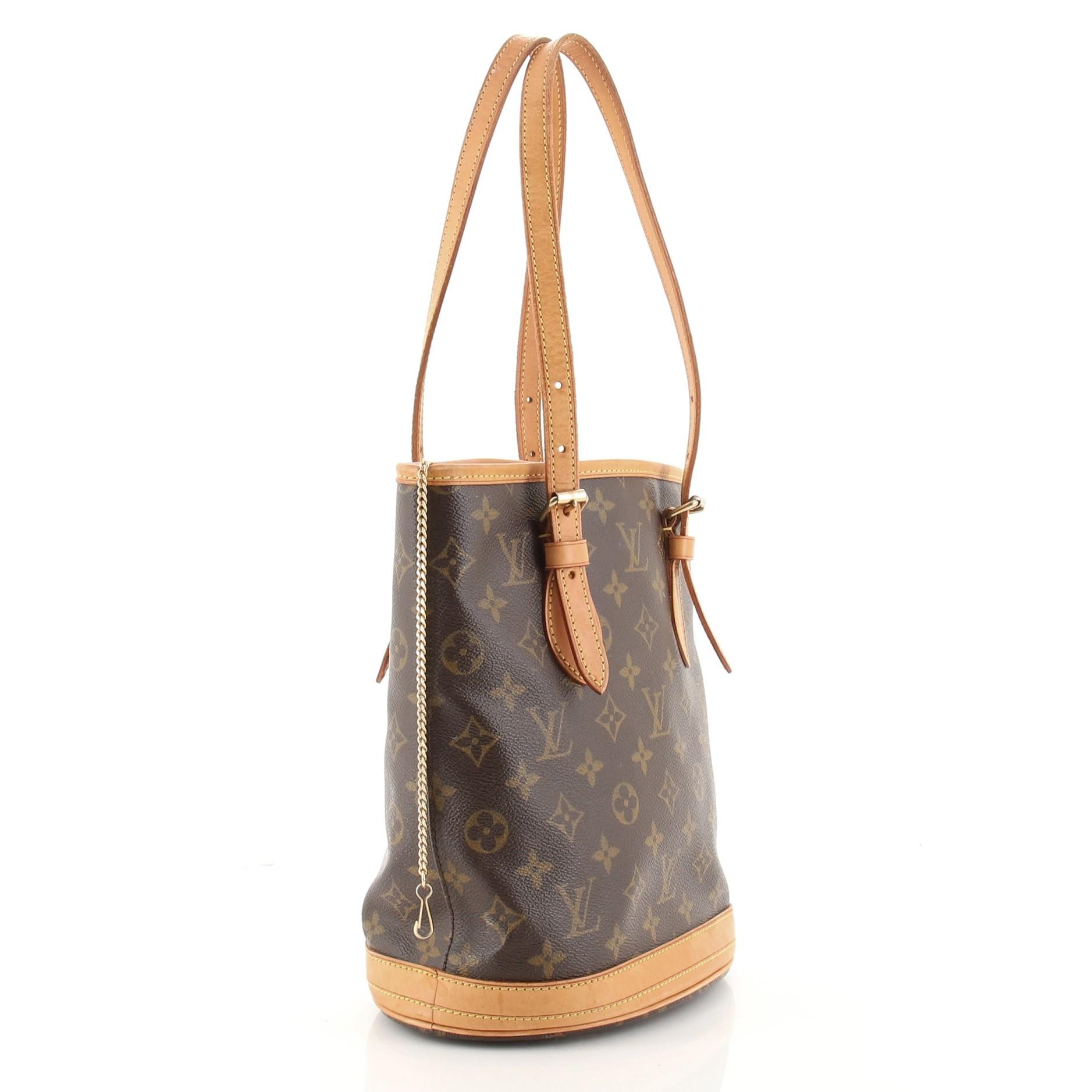Condition: Good. Odor in interior. Creasing on exterior, heavy darkening, wear, creasing, scuffs and watermarks on handles and leather trims, moderate wear on base and in interior, tarnish and scratches on hardware.
Accessories: No