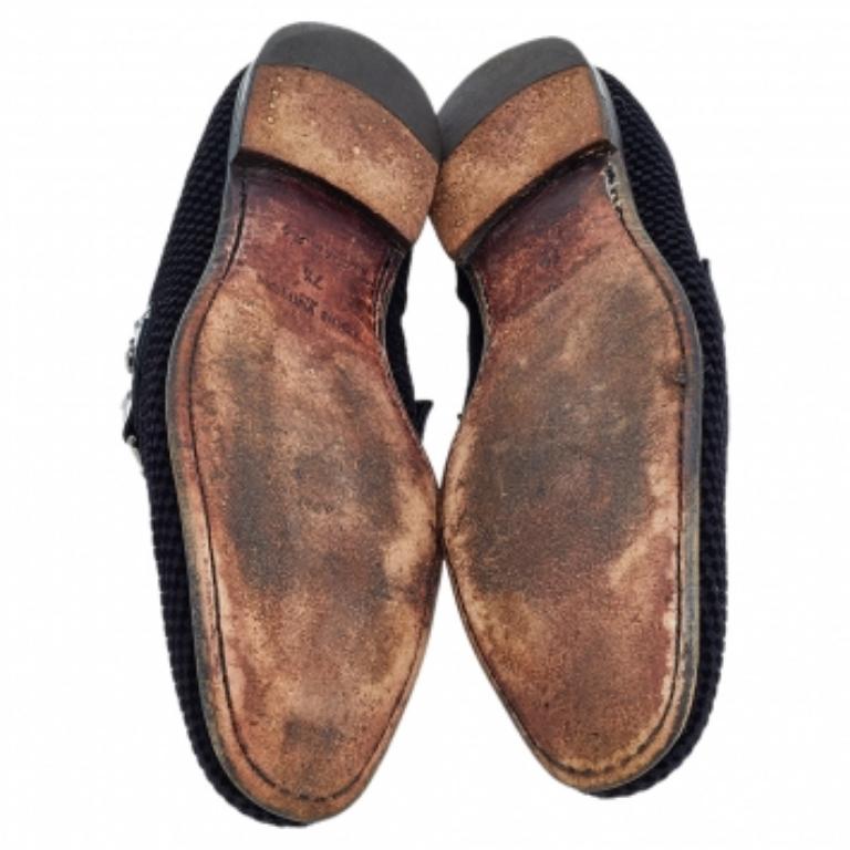 Look sharp and neat with this pair of Monte Carlo loafers from Louis Vuitton. They have been crafted from Petit Damier Ebene suede and designed with the art of fine stitching and the signature LV on the uppers. The black pair is complete with