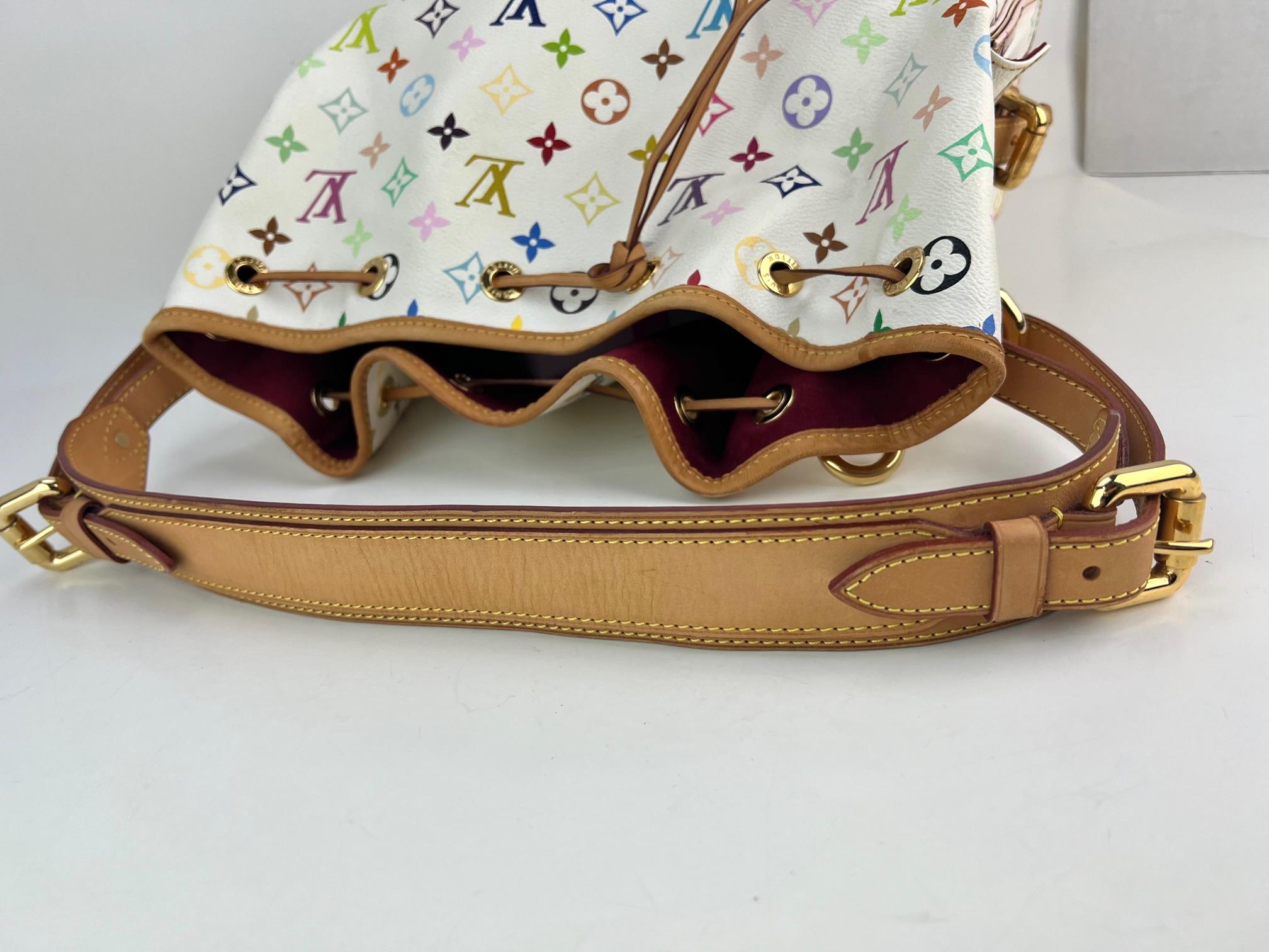 Pre-Owned 100% Authentic
LOUIS VUITTON Petit Noe White Multicolor Bucket Bag
RATING: B...Very Good, well maintained,
shows minor signs of wear
MATERIAL: multicolor monogram canvas
LEATHER PIPING: around top has wrinkling,
has faint marks
HANDLE:
