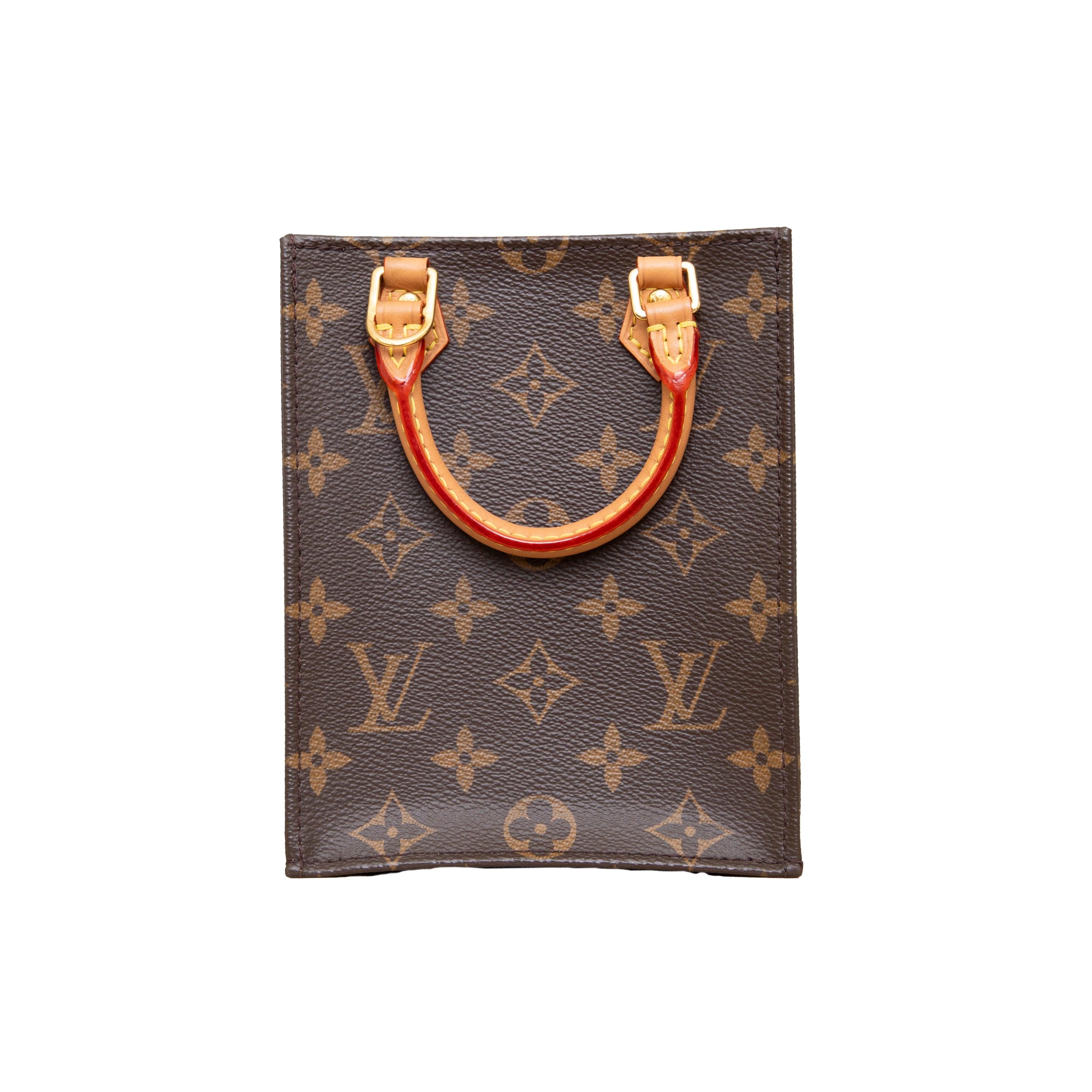 The Louis Vuitton Petit Sac Plat is a mini version of the iconic Sac Plat bag. Crafted from Monogram canvas, it features top handles and a removable leather shoulder strap. Despite its compact size, this bag is surprisingly spacious and can hold all