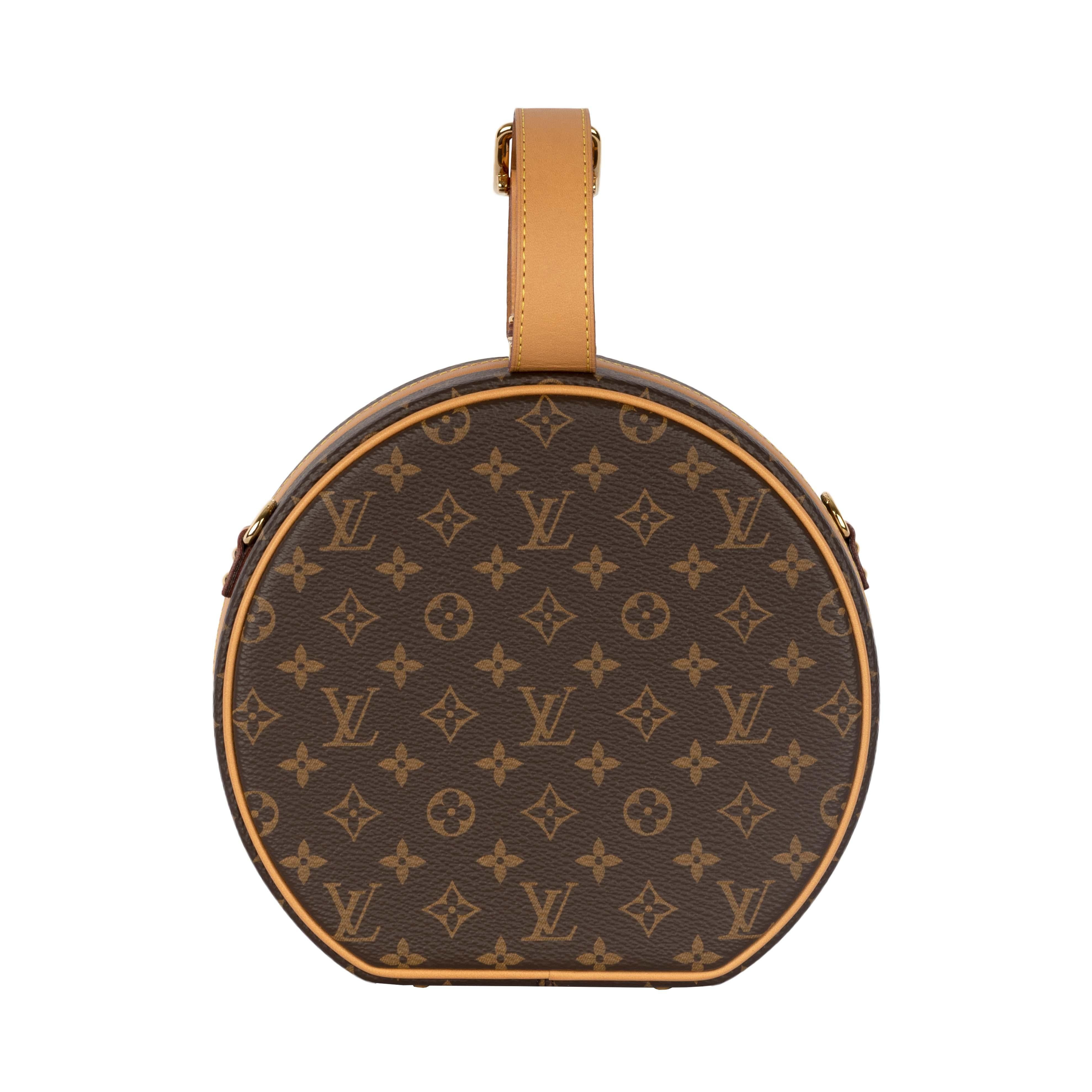 Inspired by the brand's travel history, the Louis Vuitton Petite Boite Chapeau features the brand monogram on its signature cowhide fabric. The shape resembles that of the Boite Chapeau and each metallic hardware is personalized with a unique brand