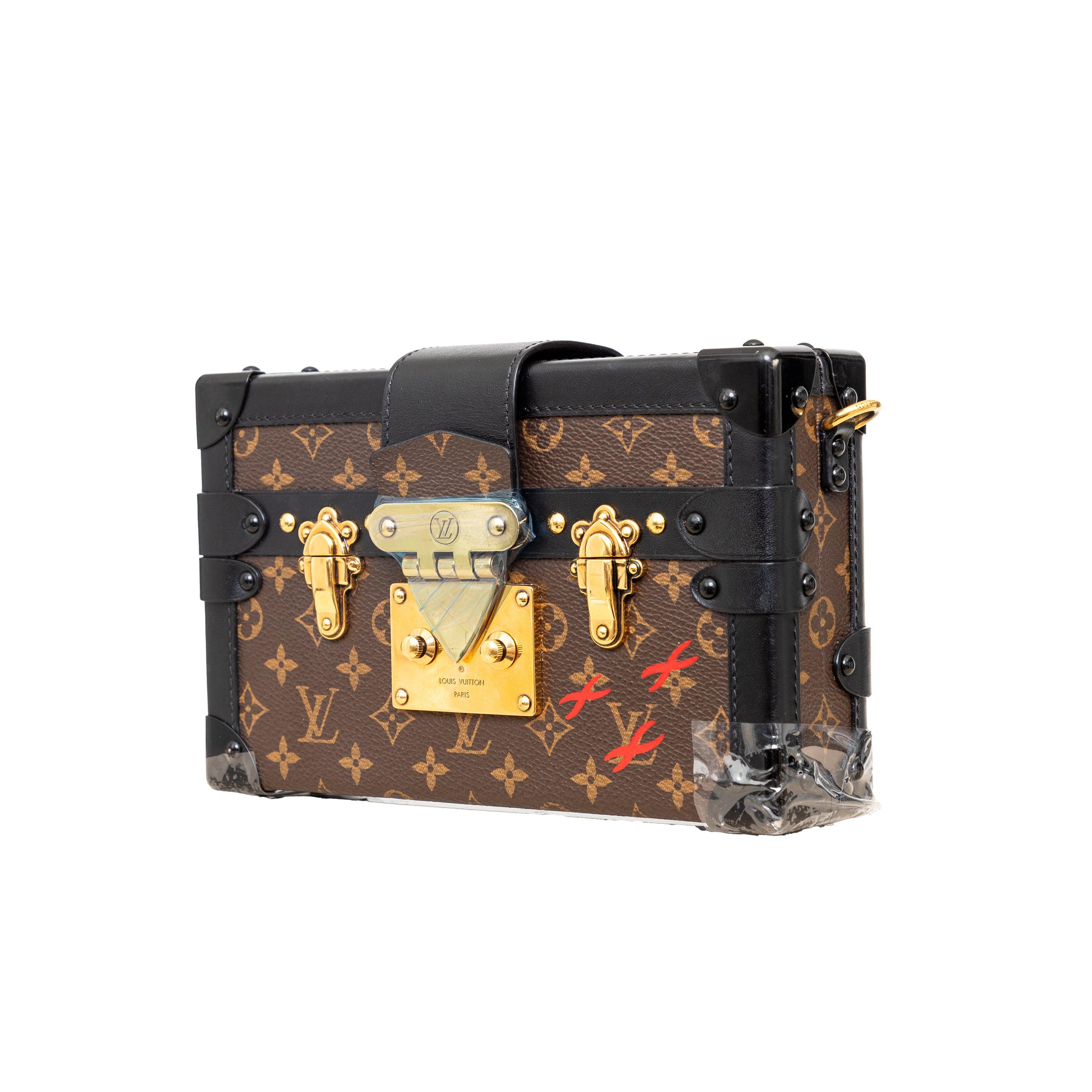 Inspired by the history of Louis Vuitton trunks, the Petite Malle handbag in iconic Monogram canvas features a gold-tone lock and fittings, smooth calfskin trim, and a sheepskin lining. Versatile for day or evening, it can be carried as a clutch or