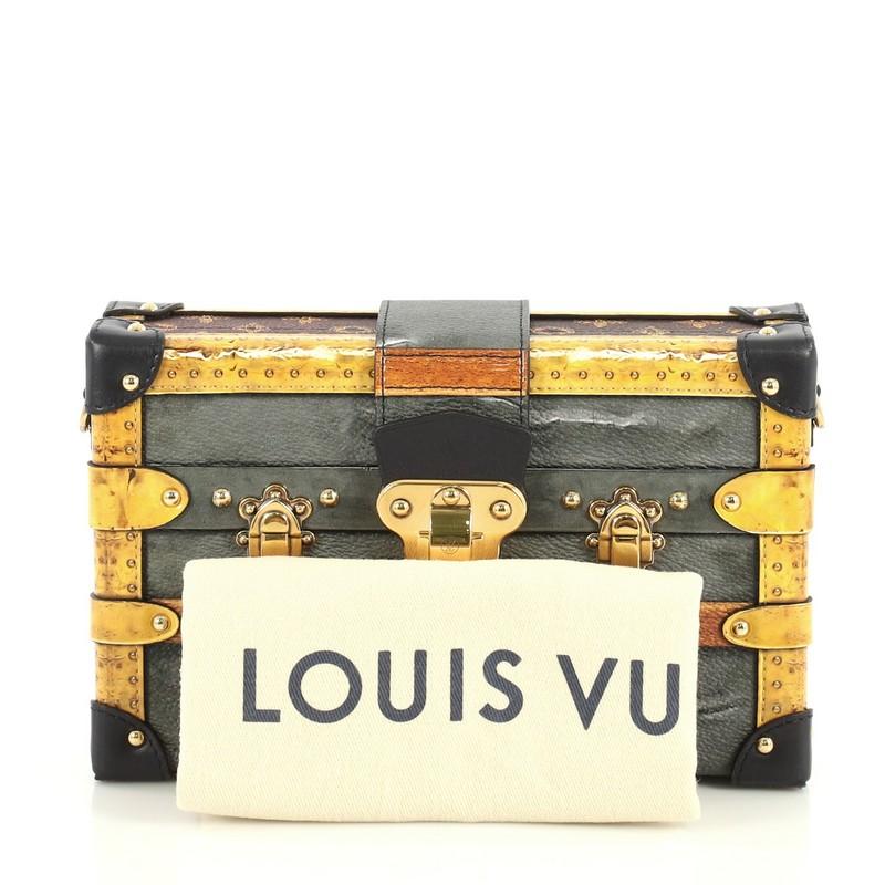 This Louis Vuitton Petite Malle Handbag Limited Edition Time Trunk, crafted from gray monogram coated canvas, features leather trim and gold-tone hardware. Its clasp closure opens to a neutral leather interior with slip pocket. Authenticity code