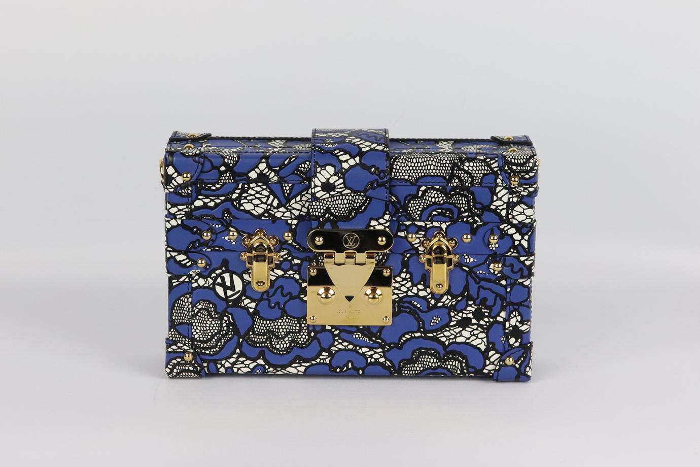 Louis Vuitton Petite Malle medium lace embossed leather clutch. Made from black, white and blue lace-embossed leather with gold-tone hardware, it has a large internal compartment and shoulder strap. Black, blue and white. Push lock fastening at