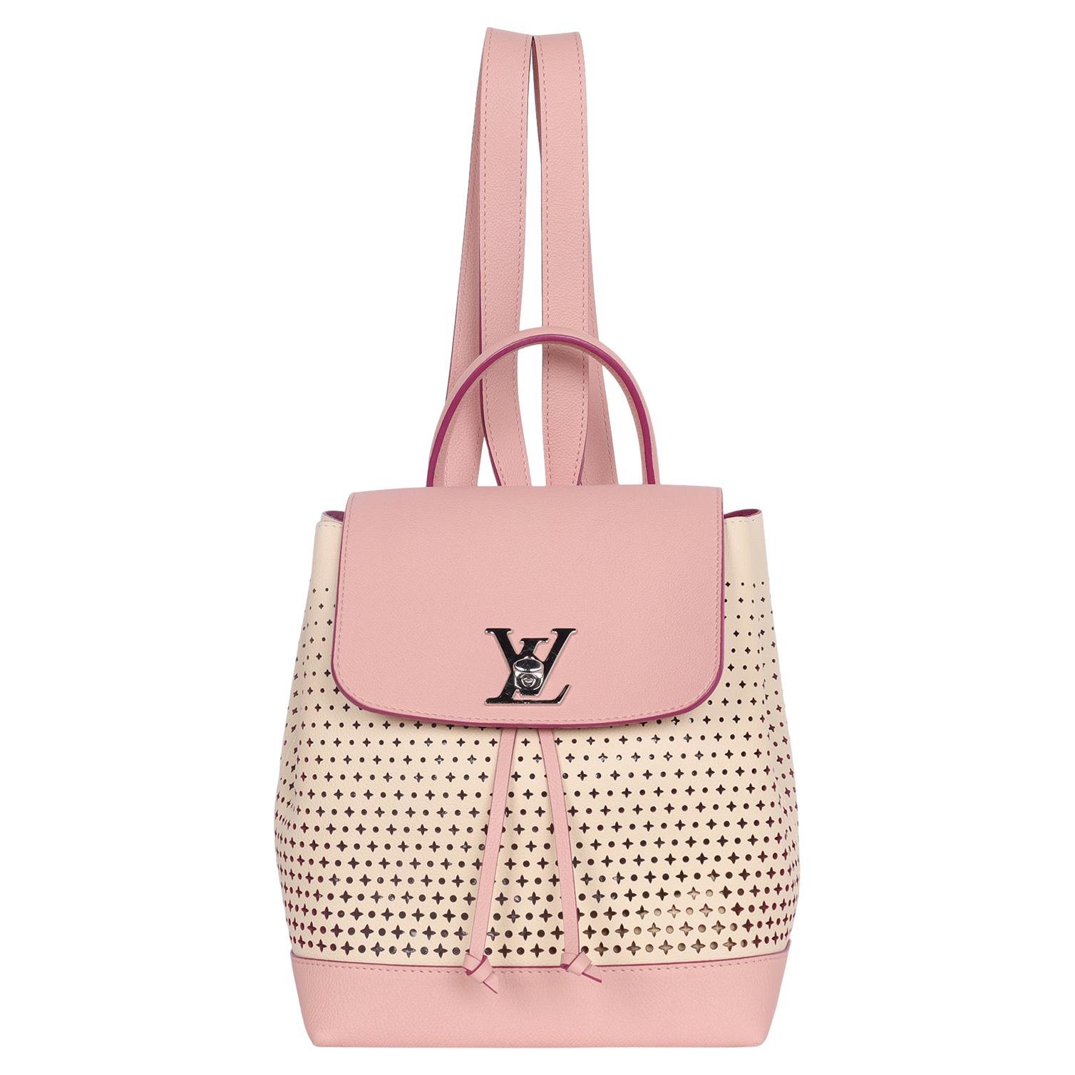 Authentic Louis Vuitton Pink Perforated Leather Lockme Backpack. Features a pink and off white perforated leather body, an adjustable top drawstring and turn lock closure, an interior slip pocket, silver hardware, adjustable shoulder straps. Super