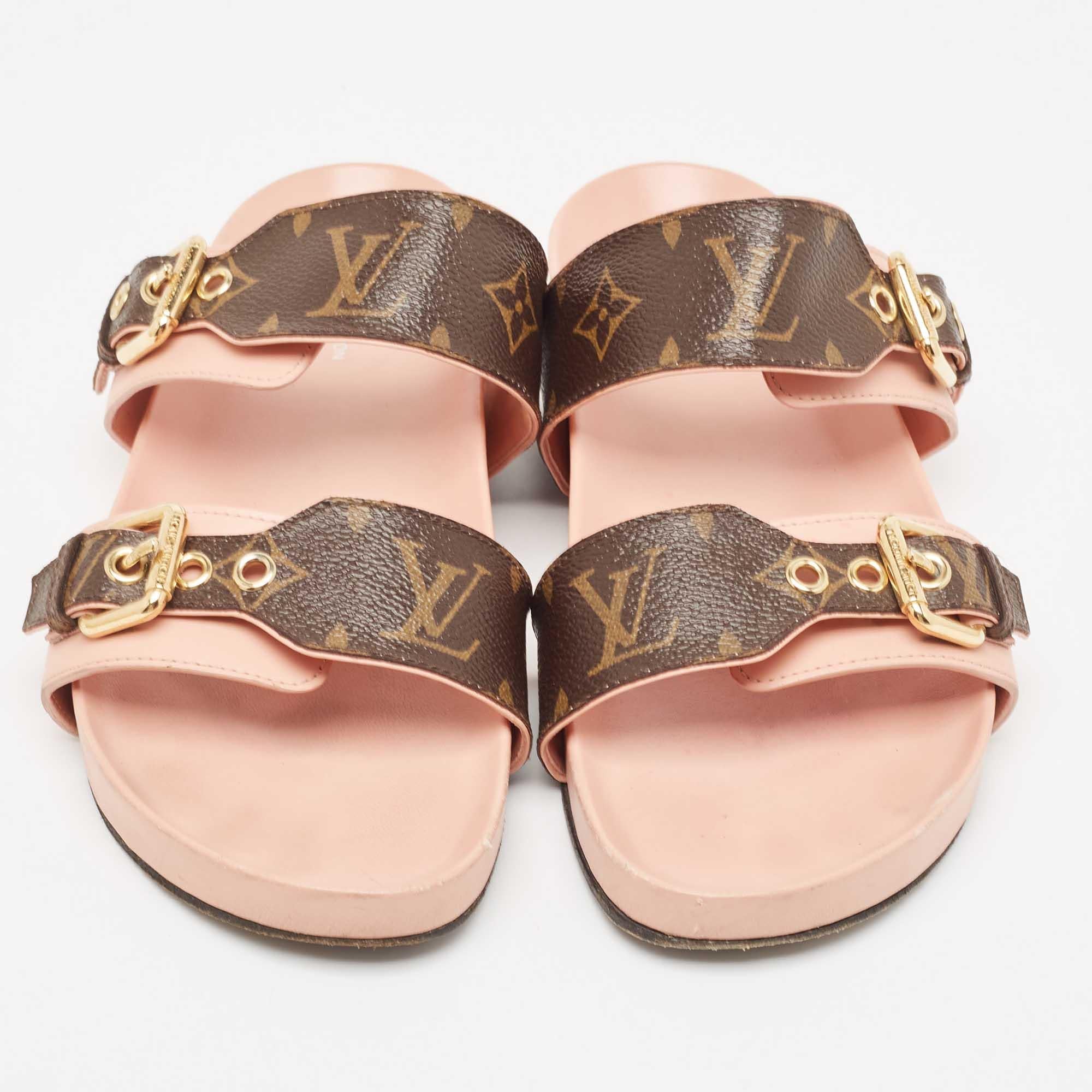 Comfort and fashion become best pals with these fabulous flat slides! The pink/brown slides from Louis Vuitton are crafted from Monogram canvas into an open-toe silhouette. They have two buckled straps and rubber soles.

Includes
Original Dustbag