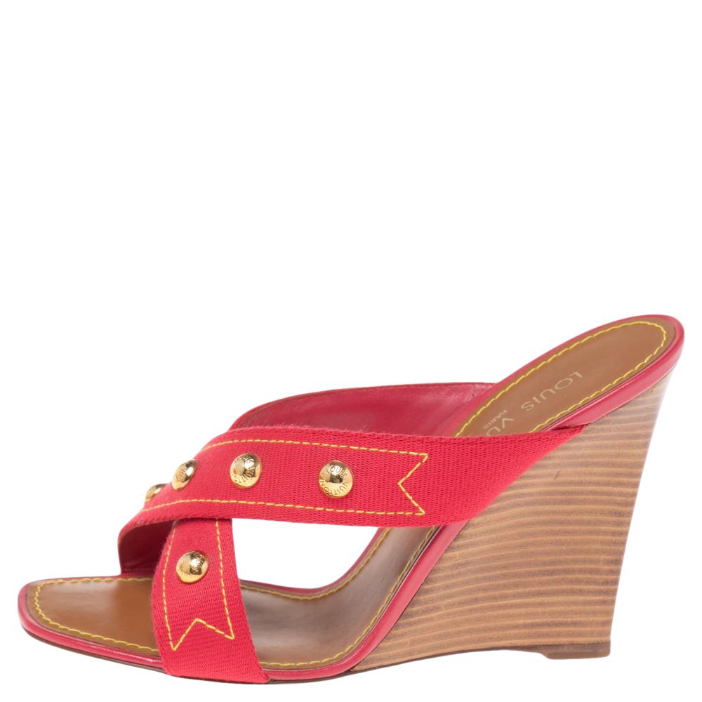 We have our hearts set on these sandals from Louis Vuitton. This pink pair has been crafted using canvas and designed with studded, cross-over straps on the vamps. They also feature wedge heels. Take this number out and enjoy both comfort and style.