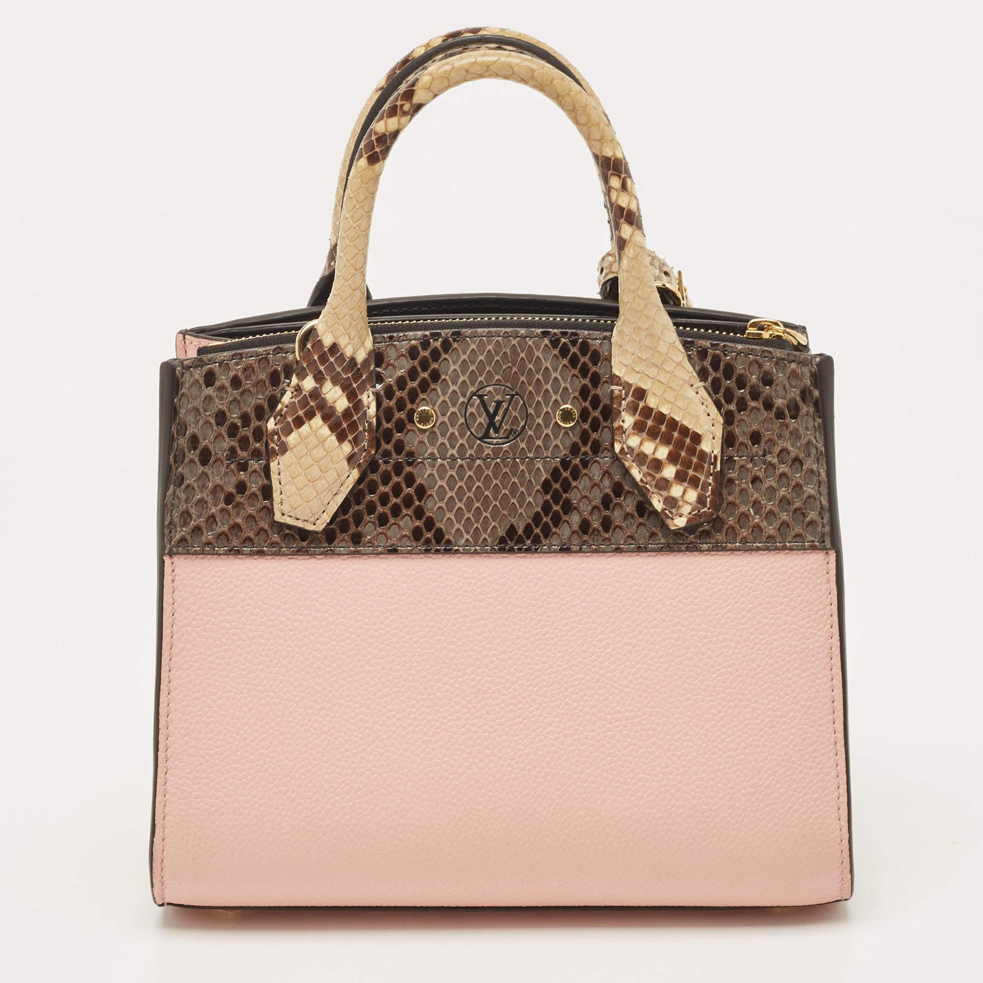 This opulent City Steamer mini bag by Louis Vuitton will ensure a harmonious mix of utility and classic appeal. Crafted from pink leather, it features python leather panels, a spacious interior, dual top rolled handles, and a detachable shoulder