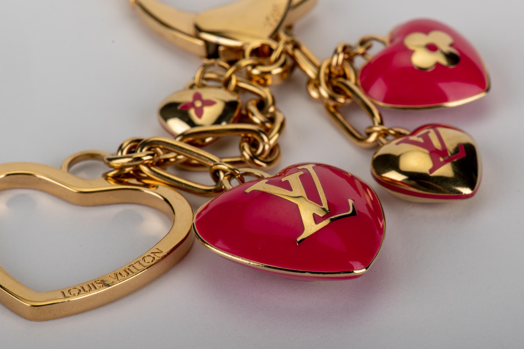 Louis Vuitton pink enamel hearts bag charm/keychain. Excellent condition. Comes in original box.