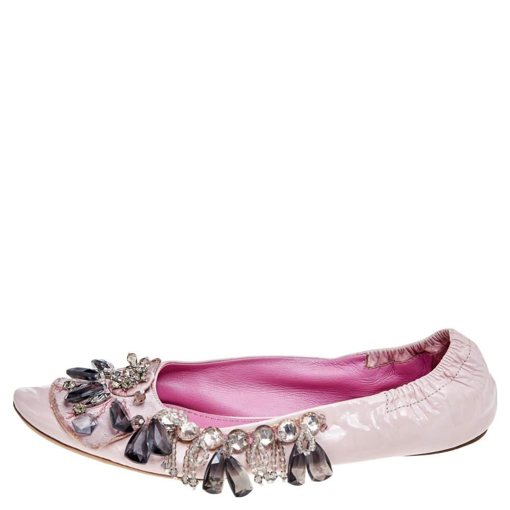 Crafted from pink leather, these Louis Vuitton ballet flats are a cute pair to own. They come with round toes and are ornamented with embellishments across the upper. They also feature scrunched counters. The insoles are leather lined.

