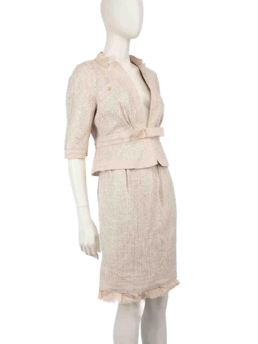 CONDITION is Good. Minor wear to set is evident. Light wear to the jacket is seen with thread pulls to the weave inside the lining, buttons at the front and back are tarnished, discolouration marks on the waist belt detail and inner lining to the
