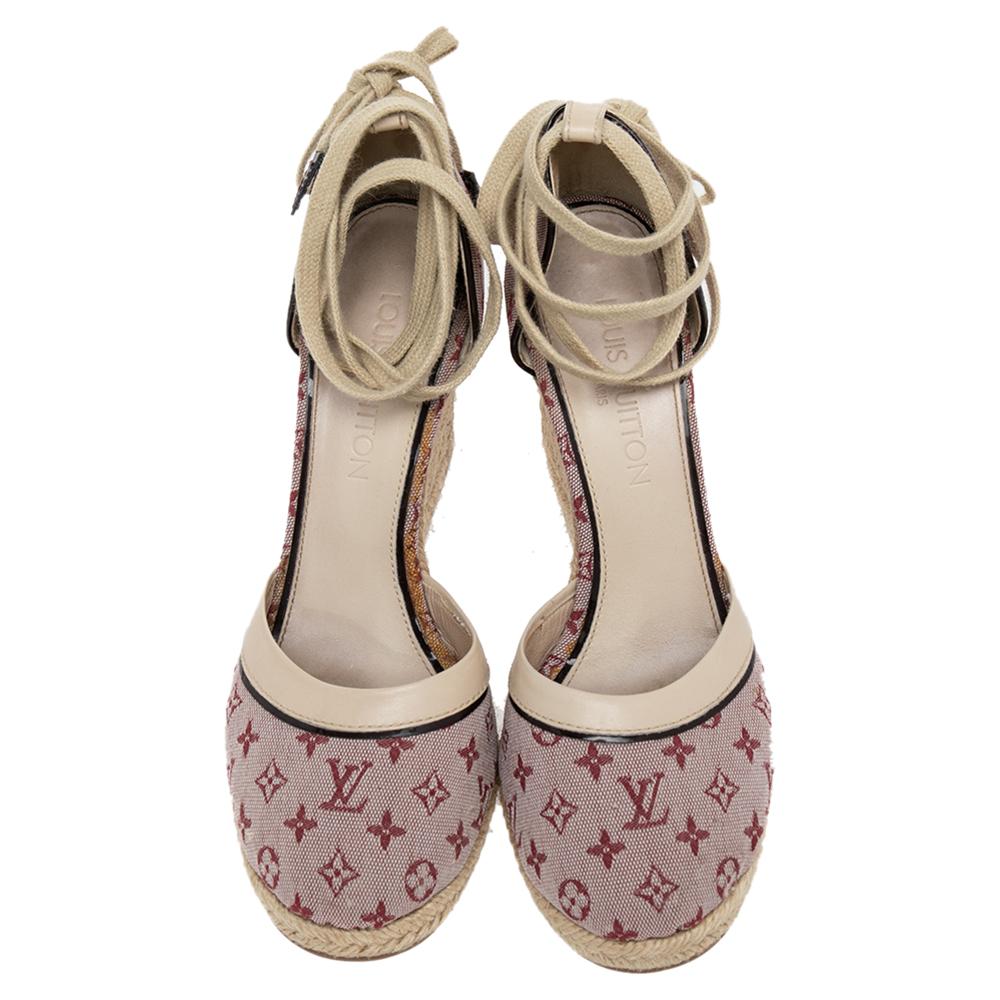 The stylish silhouette of Louis Vuitton's espadrilles is what makes them so covetable! Beautifully made from monogram canvas & leather in a pink hue, they are adorned with slender straps that elegantly wrap around the ankles. These sandals are