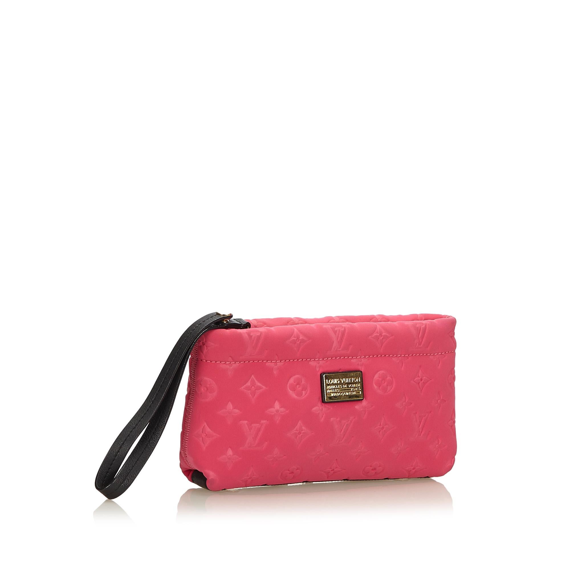 This clutch features a neoprene body, leather wristlet, and a top zip closure. It carries as AB condition rating.

Inclusions: 
Dust Bag
Box


Louis Vuitton pieces do not come with an authenticity card�please refer to the production date code within