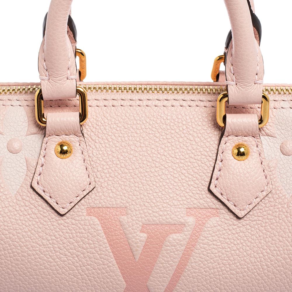 Another classic from the house of Louis Vuitton is this beautiful Papillon. The bag is made from pink Empreinte leather, lending it a high appeal. The top zip closure opens to an Alcantara interior that will safely keep your belongings and the two