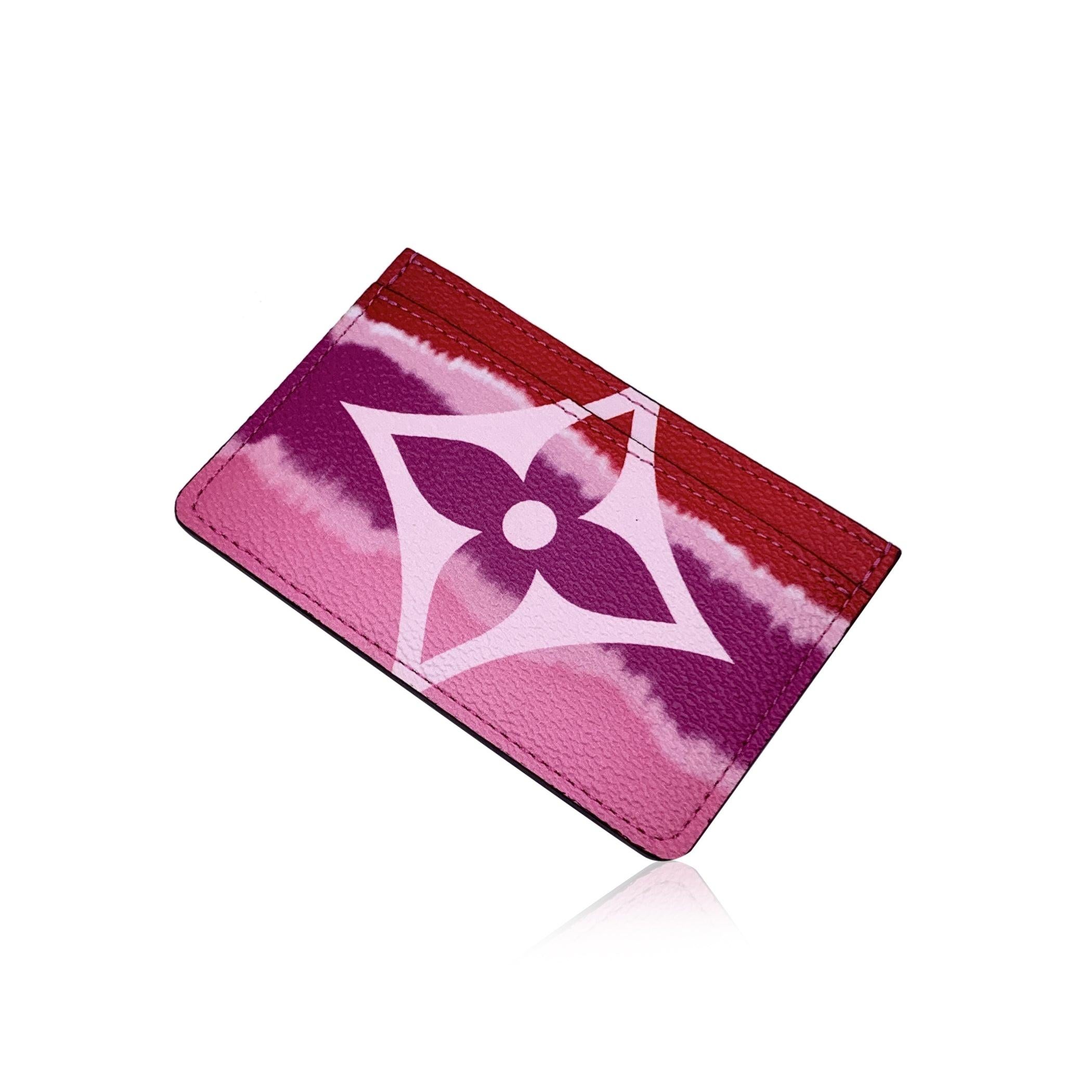 Louis Vuitton Card Holder Rouge Monogram LV Escale Card Holder. Crafted in pink and red gradient monogram canvas with red leather. 1 main compartment and 2 open pockets.. 'Louis Vuitton Paris - Made in Spain' embossed inside. Authenticity serial