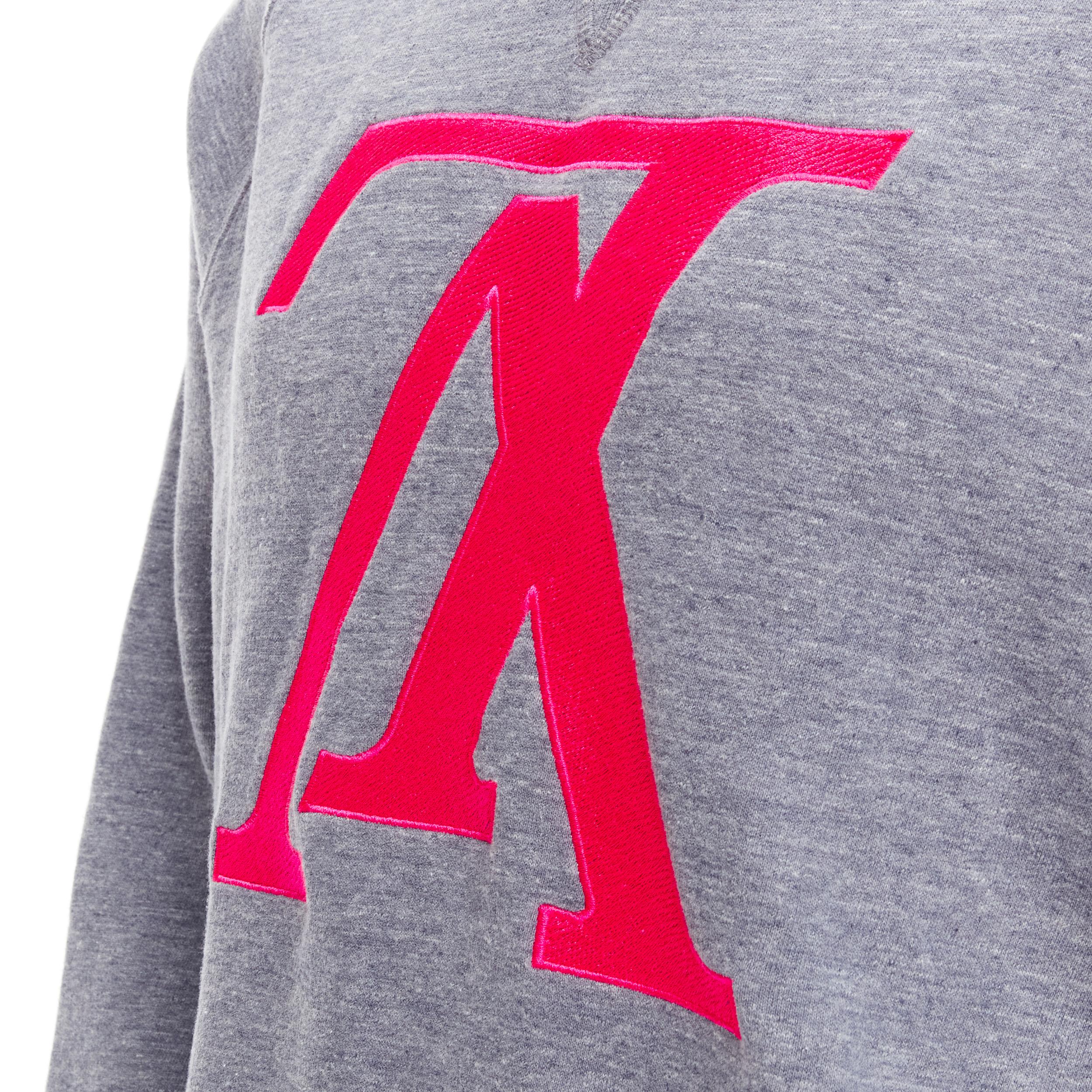 LOUIS VUITTON pink reversed LV logo embroidery grey fleece lined crew sweater XL 
Reference: TGAS/C00645 
Brand: Louis Vuitton 
Material: Cotton 
Color: Grey 
Pattern: Solid 
Extra Detail: Crew neck sweater. Fleece lining. 
Made in: Italy