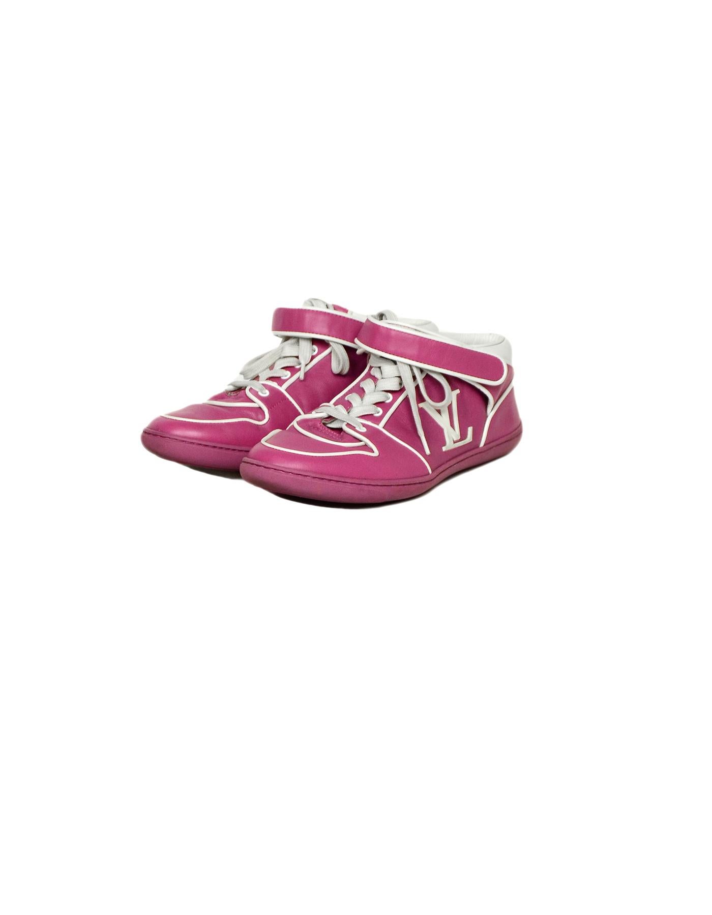 Louis Vuitton Pink Leather Logo Sneakers sz 36.5

Made In: Italy
Color: Pink, White
Materials: Leather
Closure/Opening: Lace-up
Overall Condition: Very good pre-owned condition, wear on sole and heels, marks on velcro cover.
Includes: Two