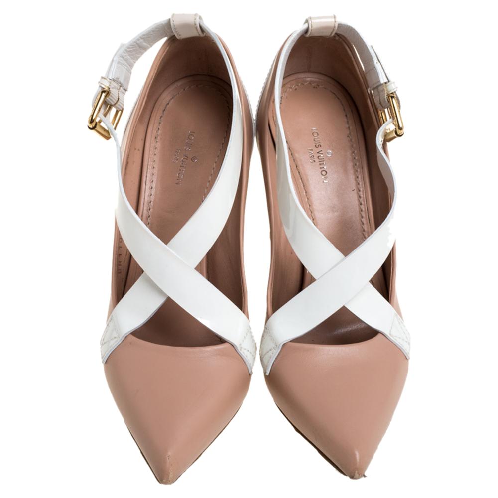 A simple pointed-toe pink pump is amplified with white crisscross straps to form the Louis Vuitton MatchMake shoe. The pumps are crafted in leather and feature buckle closure and Fleur block heels for a comfortable lift.

Includes: Original Box,