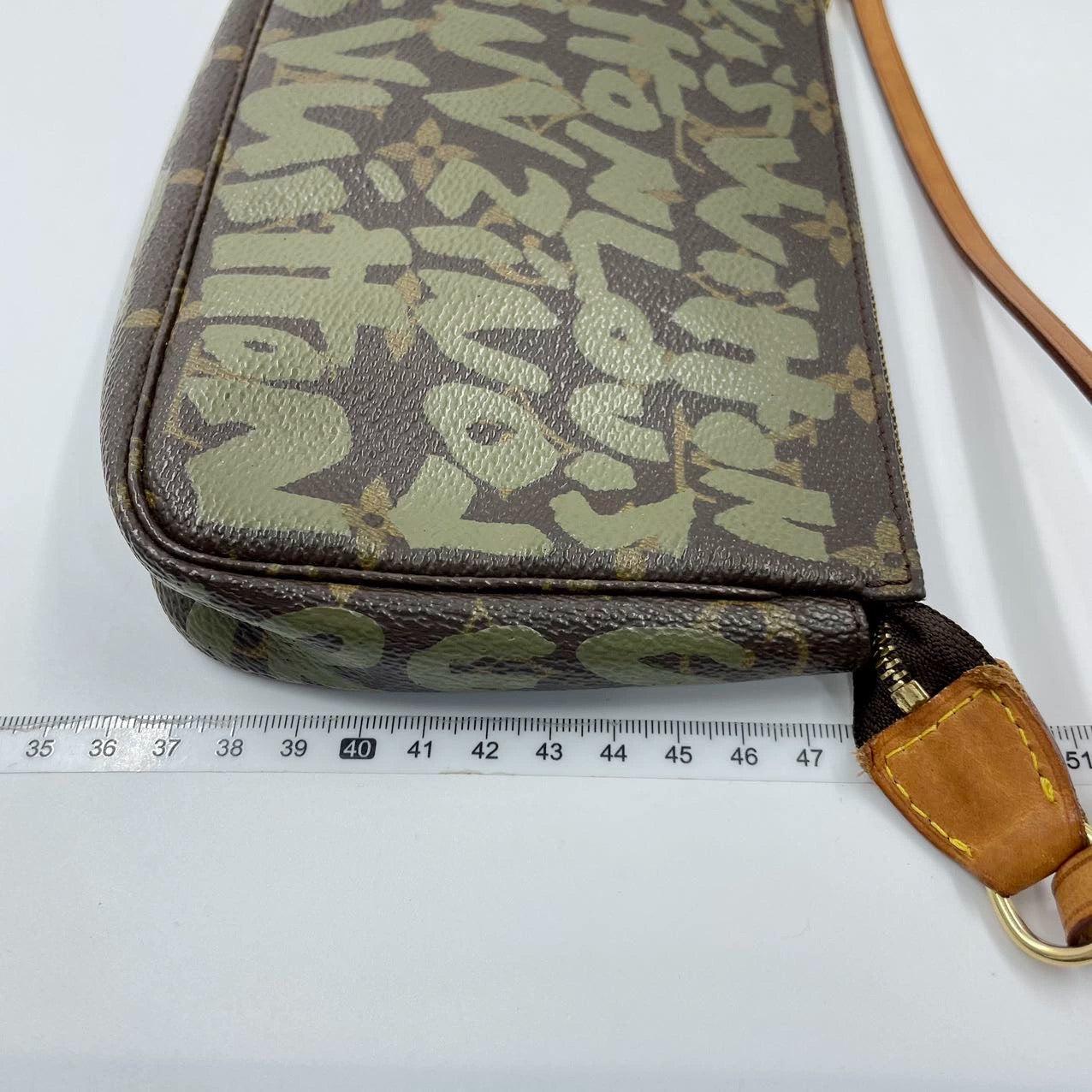 Louis Vuitton Pochette Accessoire Monogram Green Graffiti Clutch
These are professional photos of the actual bag.
  The Pochette Accessoire Bag is one of the most iconic design by the French fashion house, Louis Vuitton. It is a staple for many