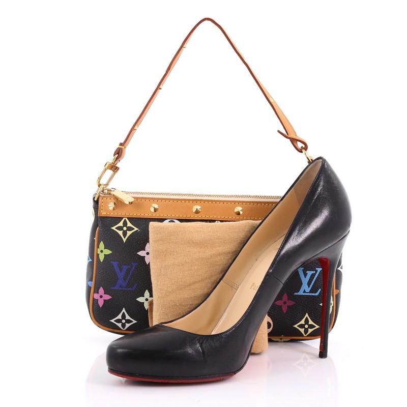 This Louis Vuitton Pochette Accessoires Monogram Multicolor, crafted from black monogram multicolor coated canvas, features a single loop shoulder strap, vachetta leather trims, and gold-tone hardware. Its top zip closure opens to a taupe microfiber