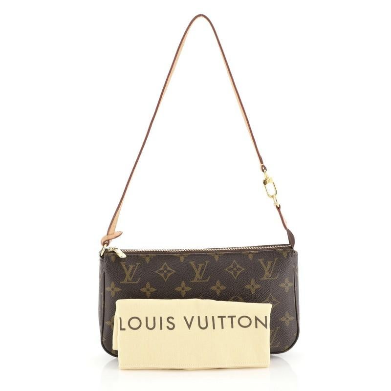 This Louis Vuitton Pochette Accessoires NM Monogram Canvas, crafted from brown monogram coated canvas, features a single loop shoulder strap and gold-tone hardware. Its zip closure opens to a brown fabric interior with slip pocket. Authenticity code
