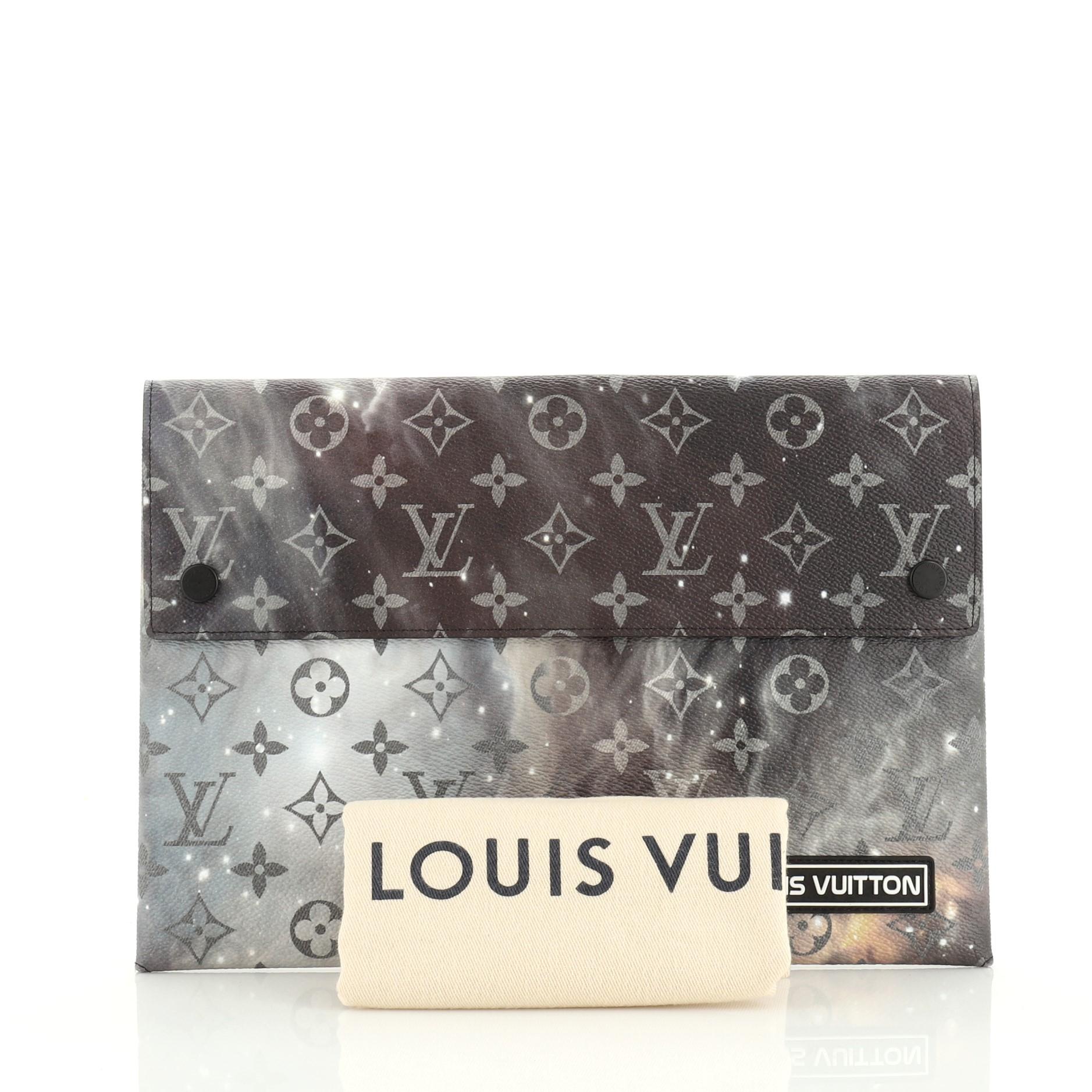 This Louis Vuitton Pochette Alpha Triple Limited Edition Monogram Galaxy Canvas, crafted from black and gray monogram galaxy coated canvas and black and silver-tone hardware. Its snap button closure opens to a black microfiber interior. Authenticity