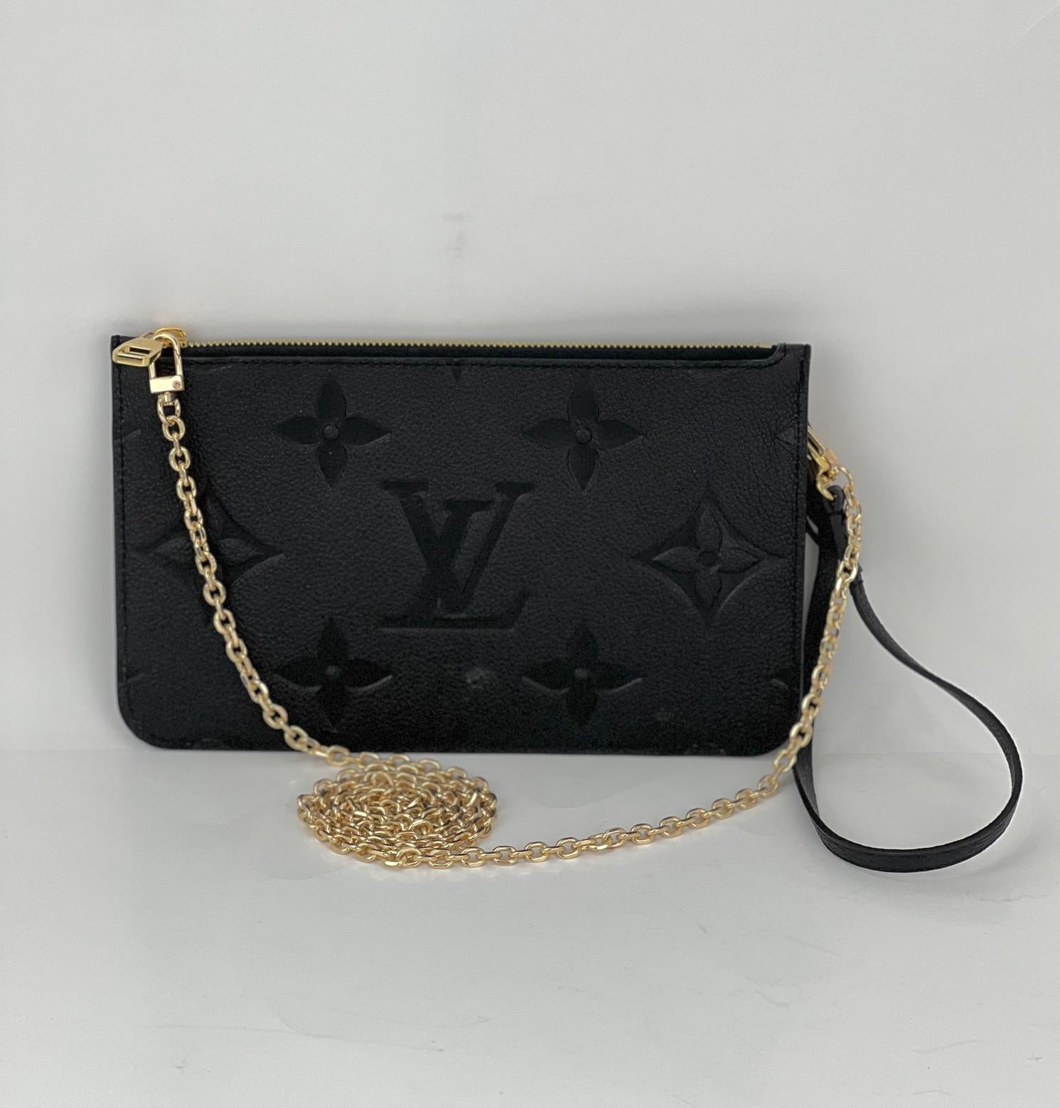 Preowned 100% Authentic
Louis Vuitton Pochette Black Empreinte Leather
from a Neverfull W/added chain to use as a
Shoulder or Crossbody Bag
RATING: A...excellent, near mint, only 
slight signs of wear
MATERIAL: embossed monogram Empreinte