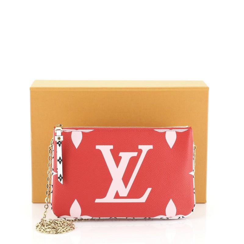 This Louis Vuitton Pochette Double Zip Limited Edition Colored Monogram Giant, crafted from pink and multicolor monogram coated canvas, features chain link strap and gold-tone hardware. It opens to a pink microfiber interior with two zip
