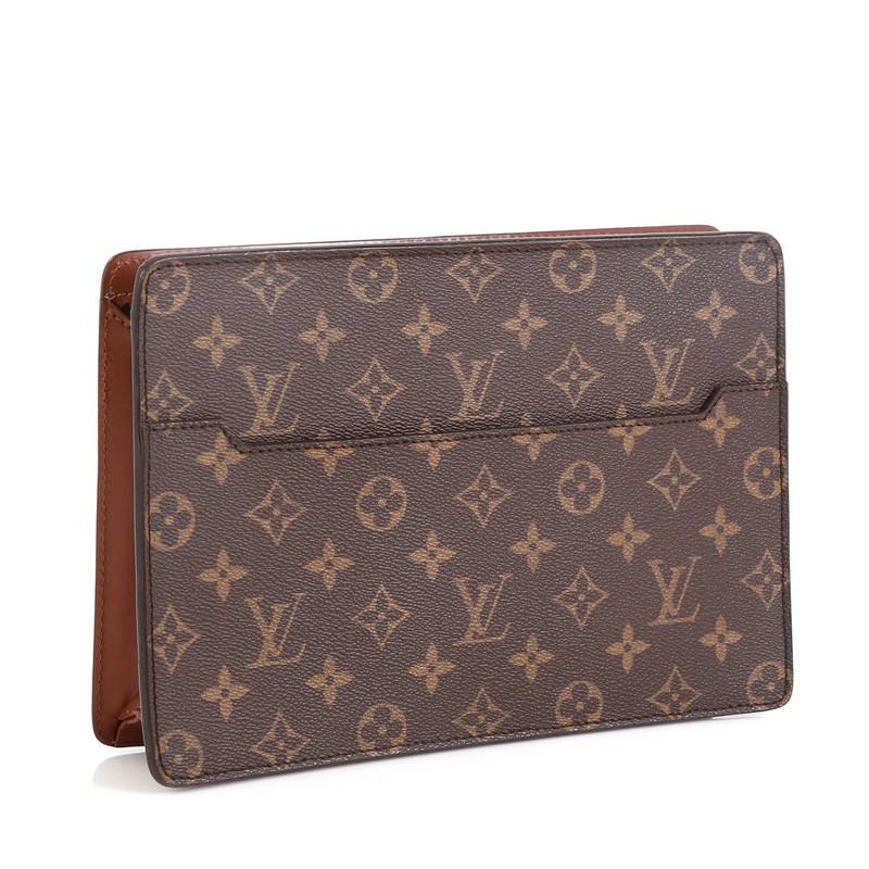 This Louis Vuitton Pochette Homme Monogram Canvas, crafted from brown monogram coated canvas, features exterior front pocket and gold-tone hardware. Its zip closure opens to a brown leather interior. Authenticity code reads: SL0939. 

Estimated