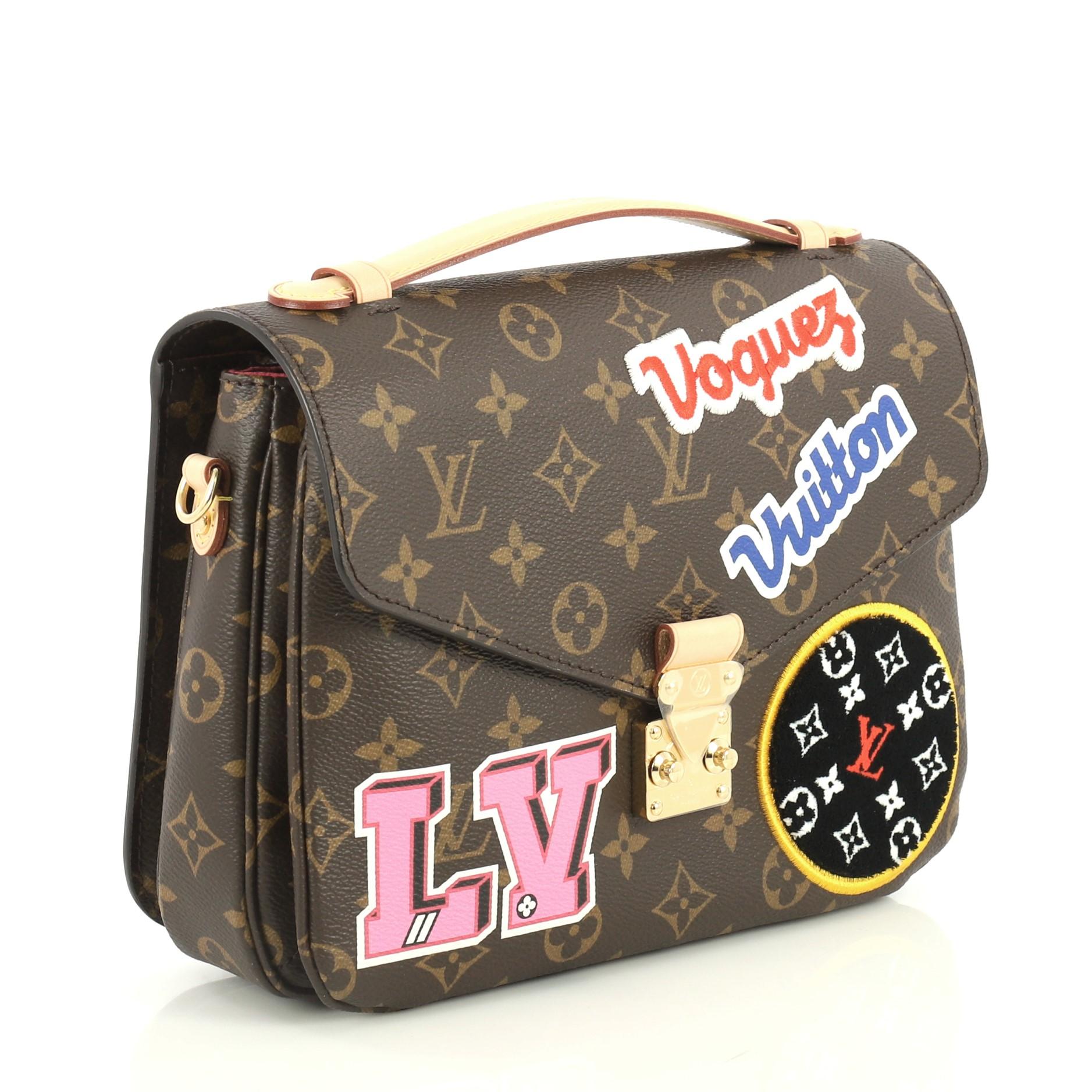 This Louis Vuitton Pochette Metis Limited Edition Patches Monogram Canvas, crafted in brown monogram coated canvas, features a leather top handle, exterior back zip pocket, patches design and gold-tone hardware. Its S-lock closure opens to a pink