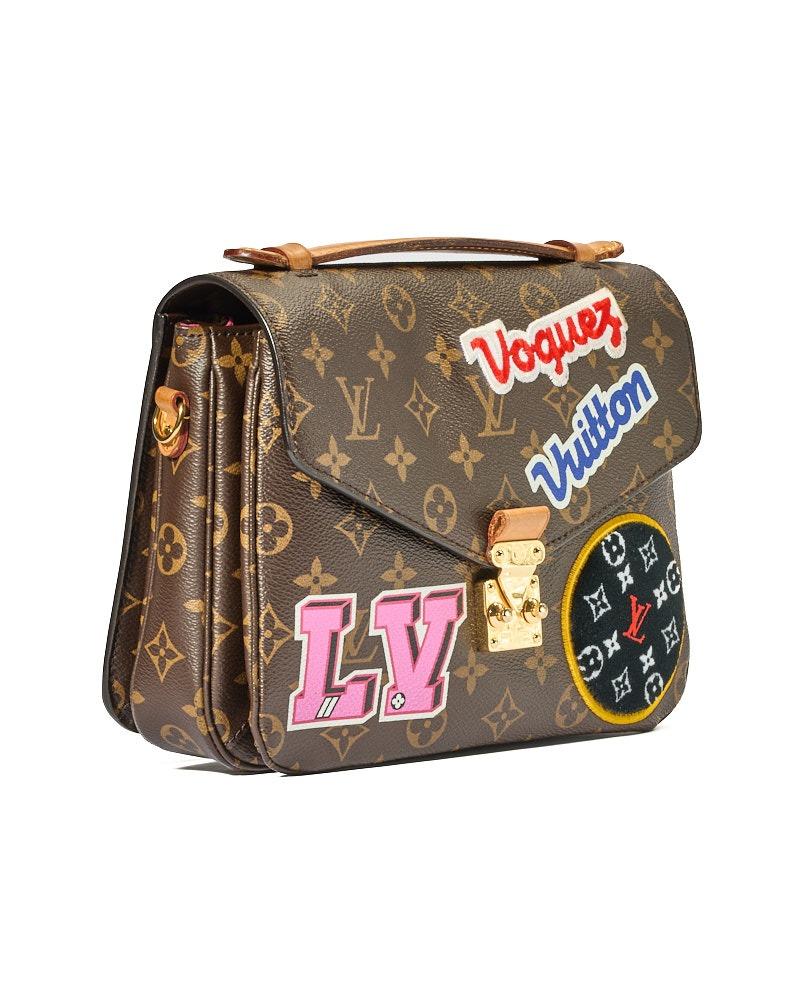 Louis Vuitton signature bag, Pochette Metis model in size MM, made of brown canvas in classic monogram pattern and embellished with embossed patches with gold hardware. Featuring a front flap with an interlocking closure, internally lined in fuchsia